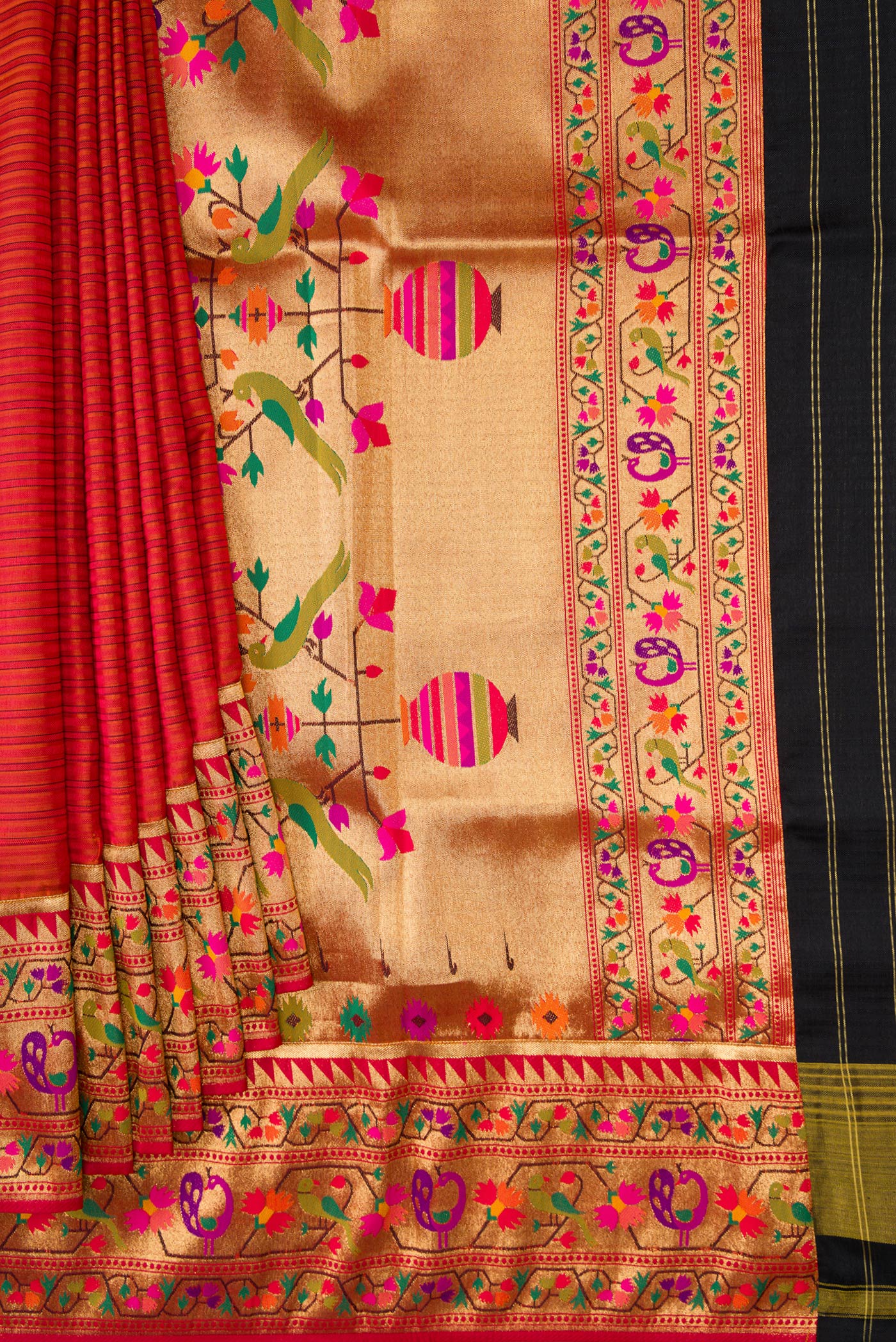 Pleats and pallu of Red Dual Tone Rajkot Patola Silk Saree with Stripes on the body and Paithani Border. 