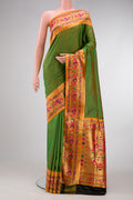 Green Dual Tone Rajkot Patola Silk Saree with Stripes on the body and Paithani Border.  displayed on a mannequin