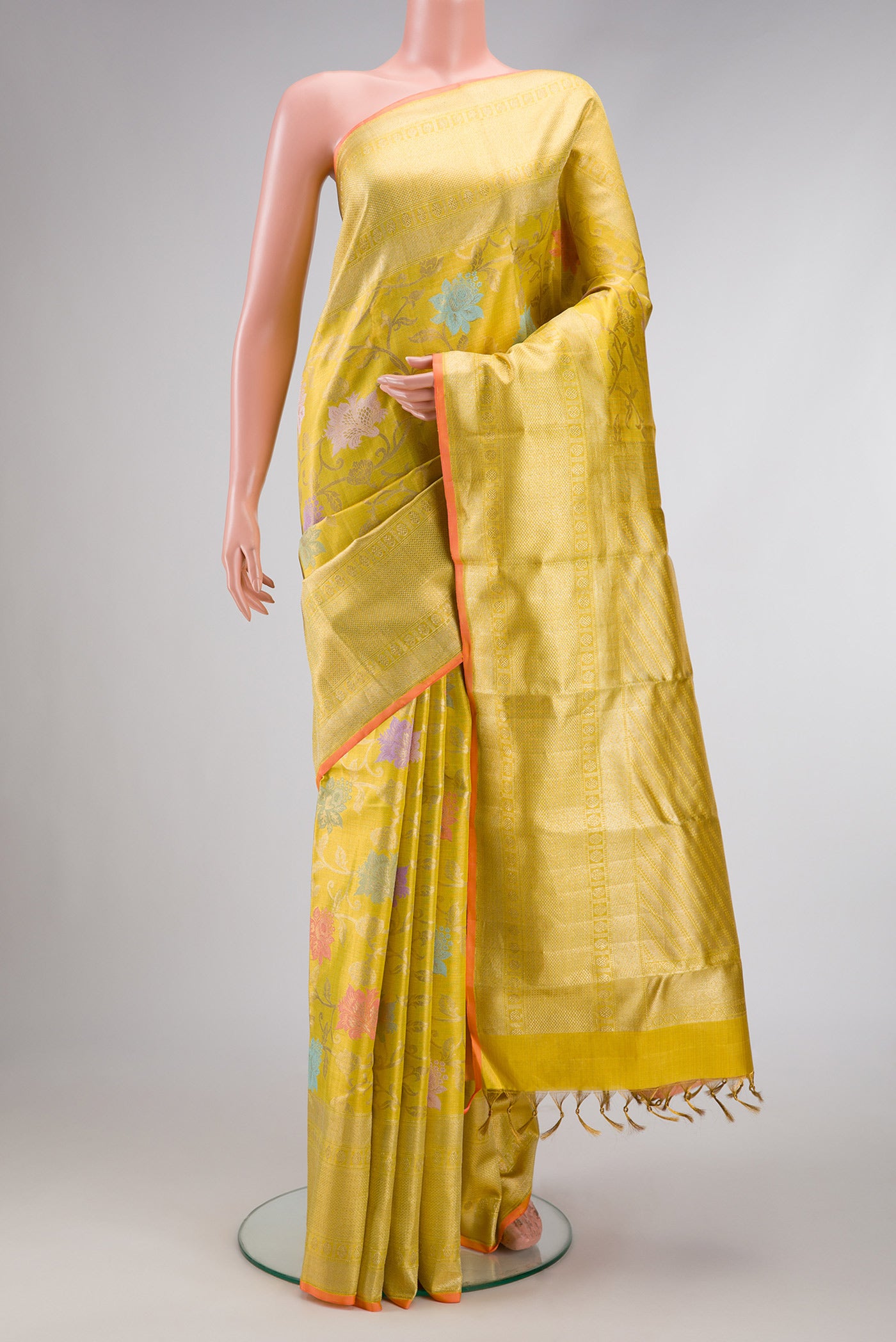 Gold Dual Tone Kanjivaram Tissue Silk Saree with Zari Brocade on the body and Zari Border.  displayed on a mannequin