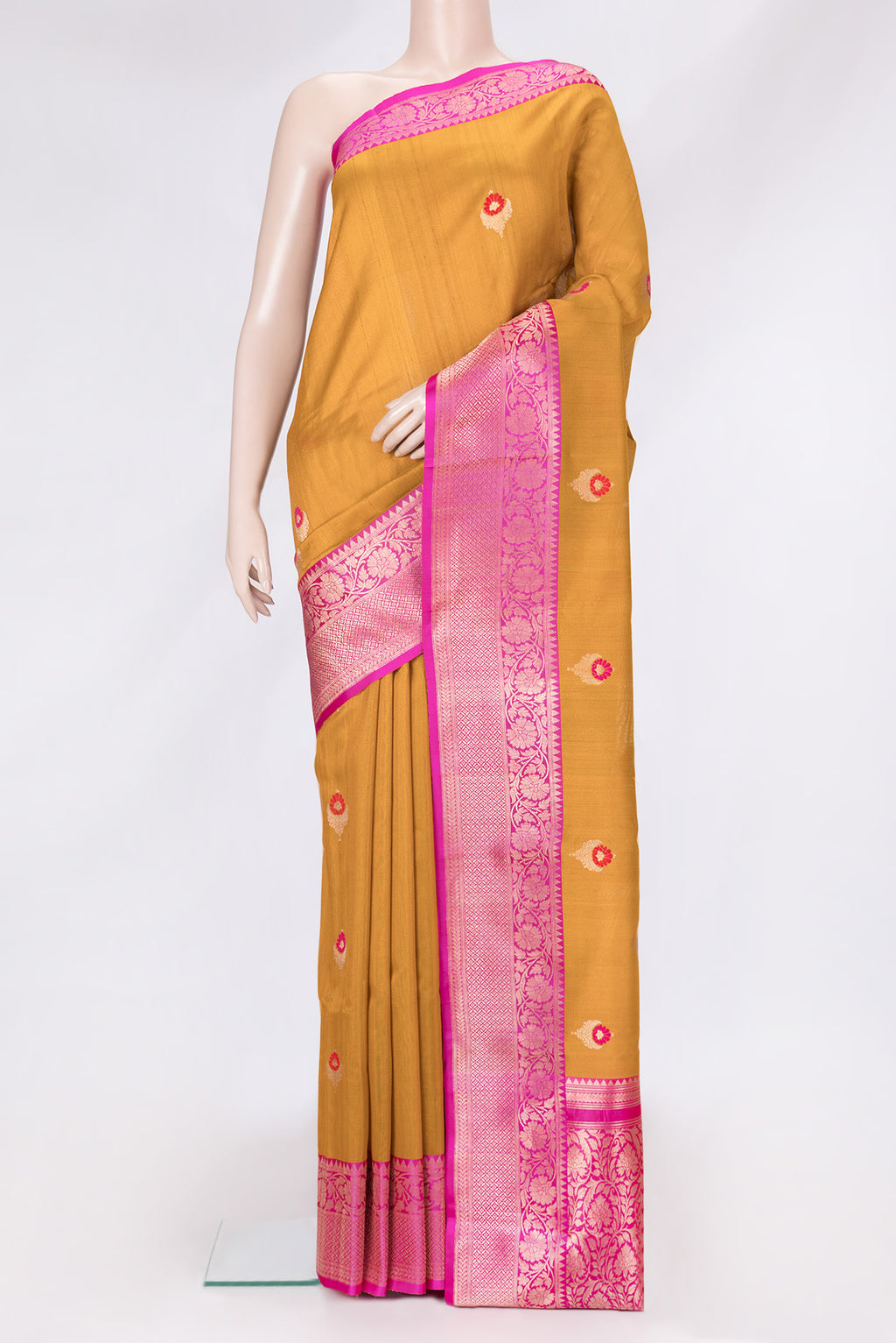 Mustard Dual Tone Tussar Silk Saree with Zari And Thread Butta on the body and Zari Border.  displayed on a mannequin