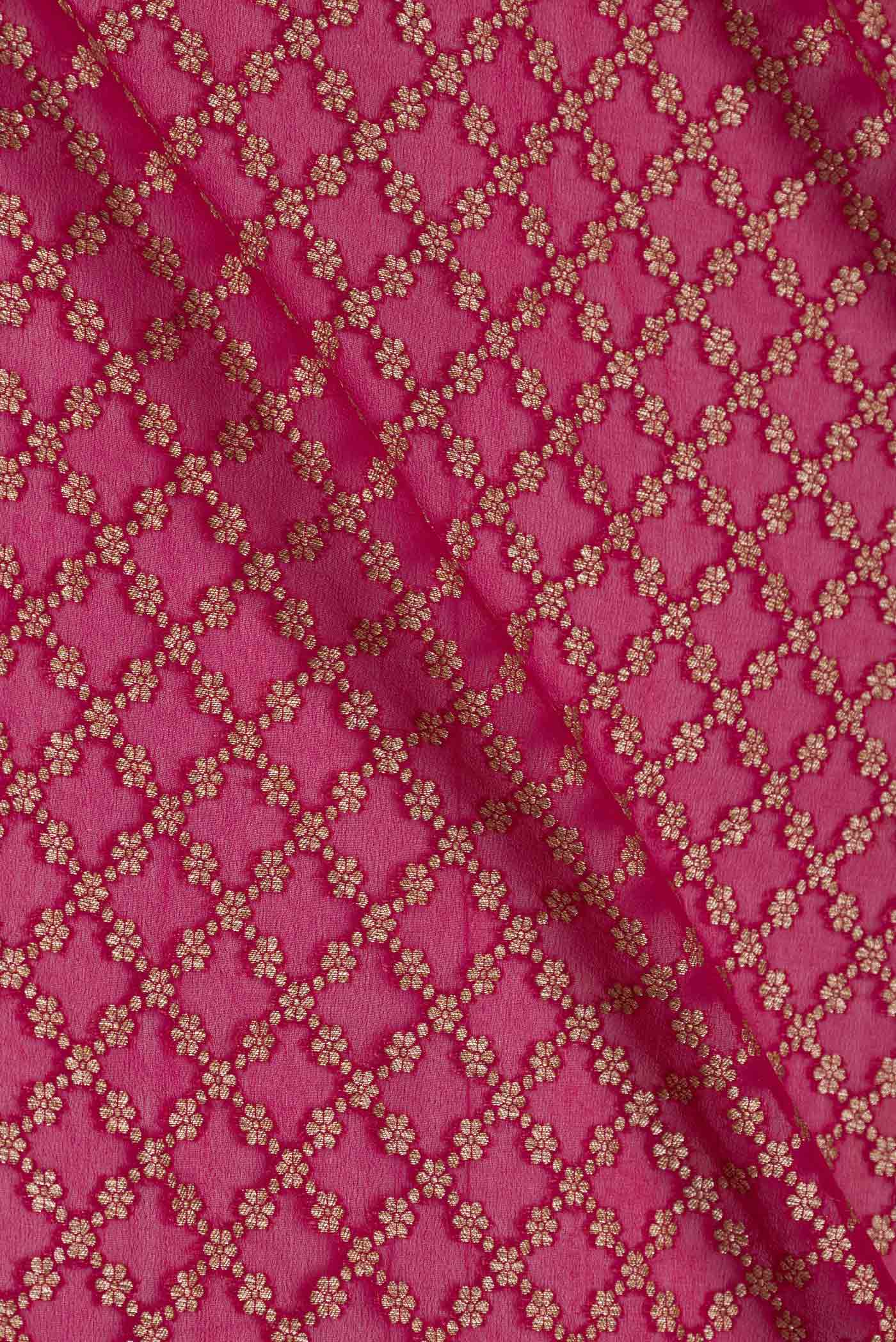 Close up of Magenta Banarasi Georgette Saree with Zari Brocade on the body and Zari Border displaying folds