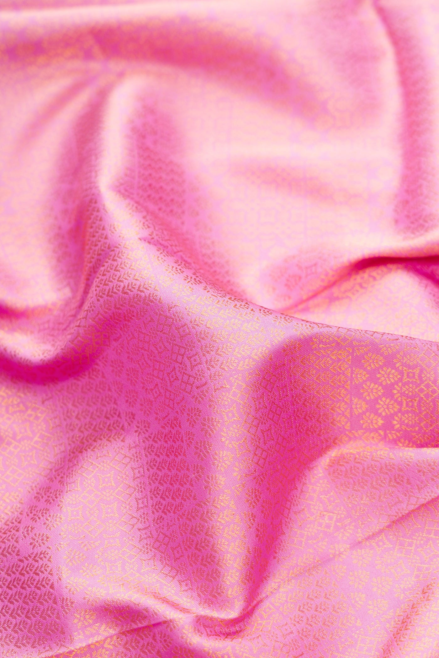 Close up of Pink Dual Tone Kanjivaram Silk Saree with Zari Brocade on the body and Zari Border.  displaying folds