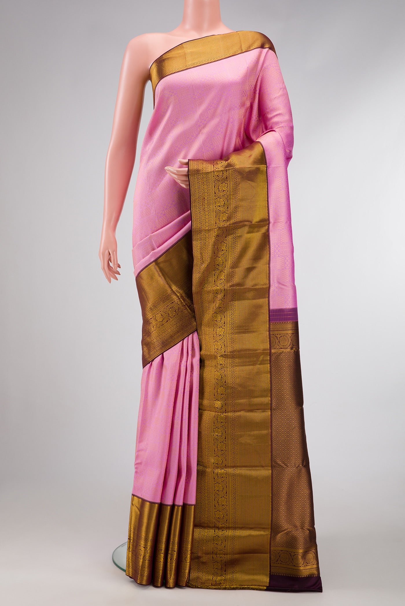 Pink Dual Tone Kanjivaram Silk Saree with Zari Brocade on the body and Zari Border.  displayed on a mannequin