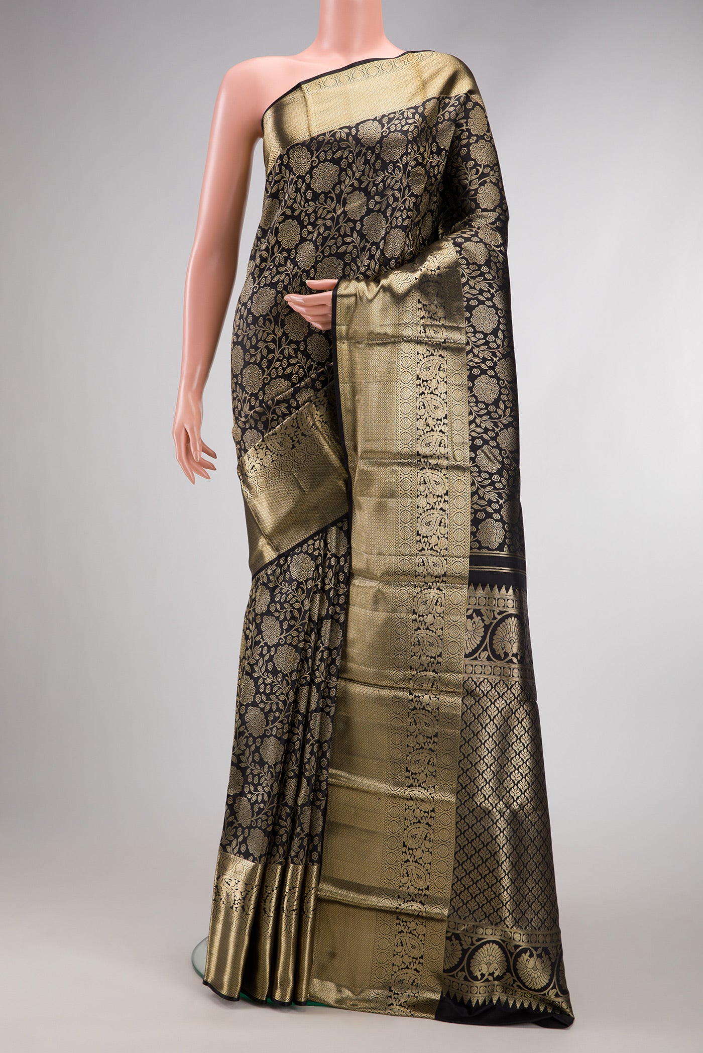 Black Dual Tone Kanchipuram Silk Saree with Zari Brocade on the body and Zari Border.  displayed on a mannequin