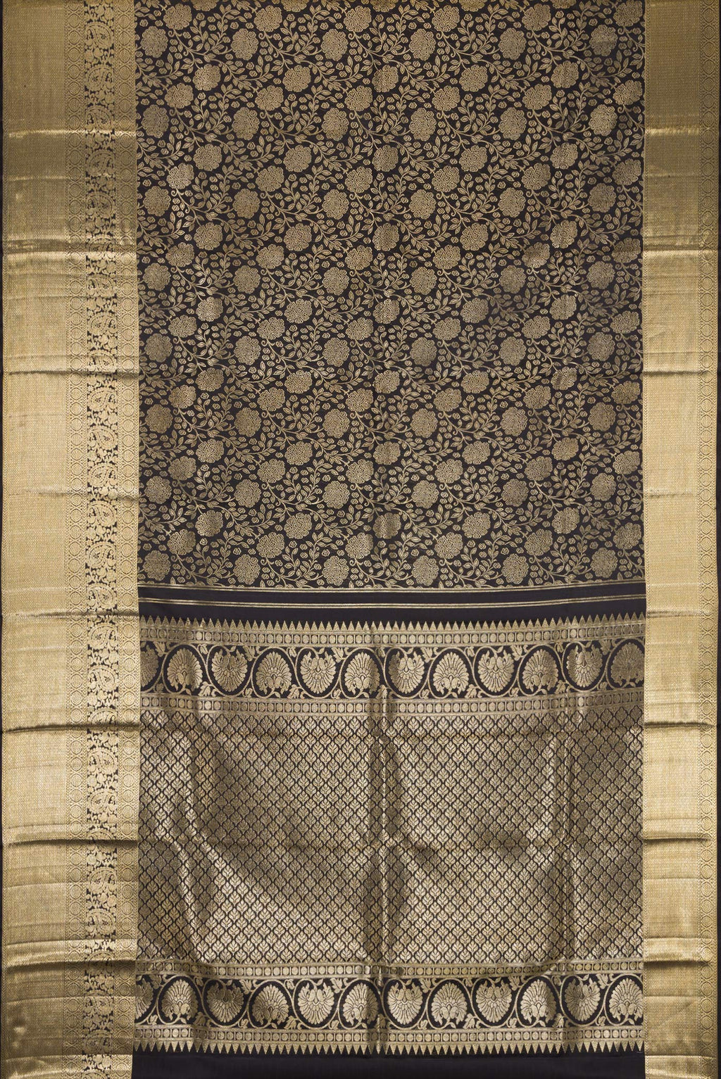 Flat view of Black Dual Tone Kanchipuram Silk Saree with Zari Brocade on the body and Zari Border. 