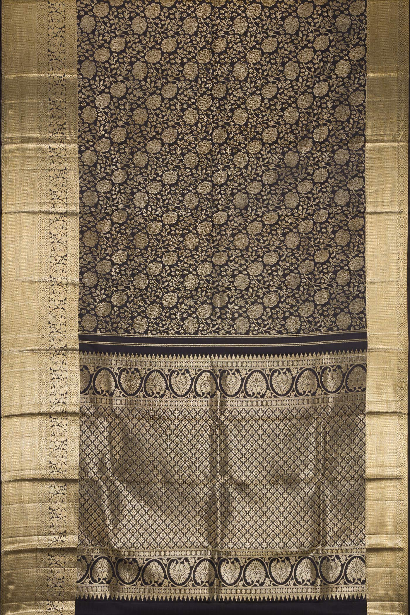 Flat view of Black Dual Tone Kanchipuram Silk Saree with Zari Brocade on the body and Zari Border. 