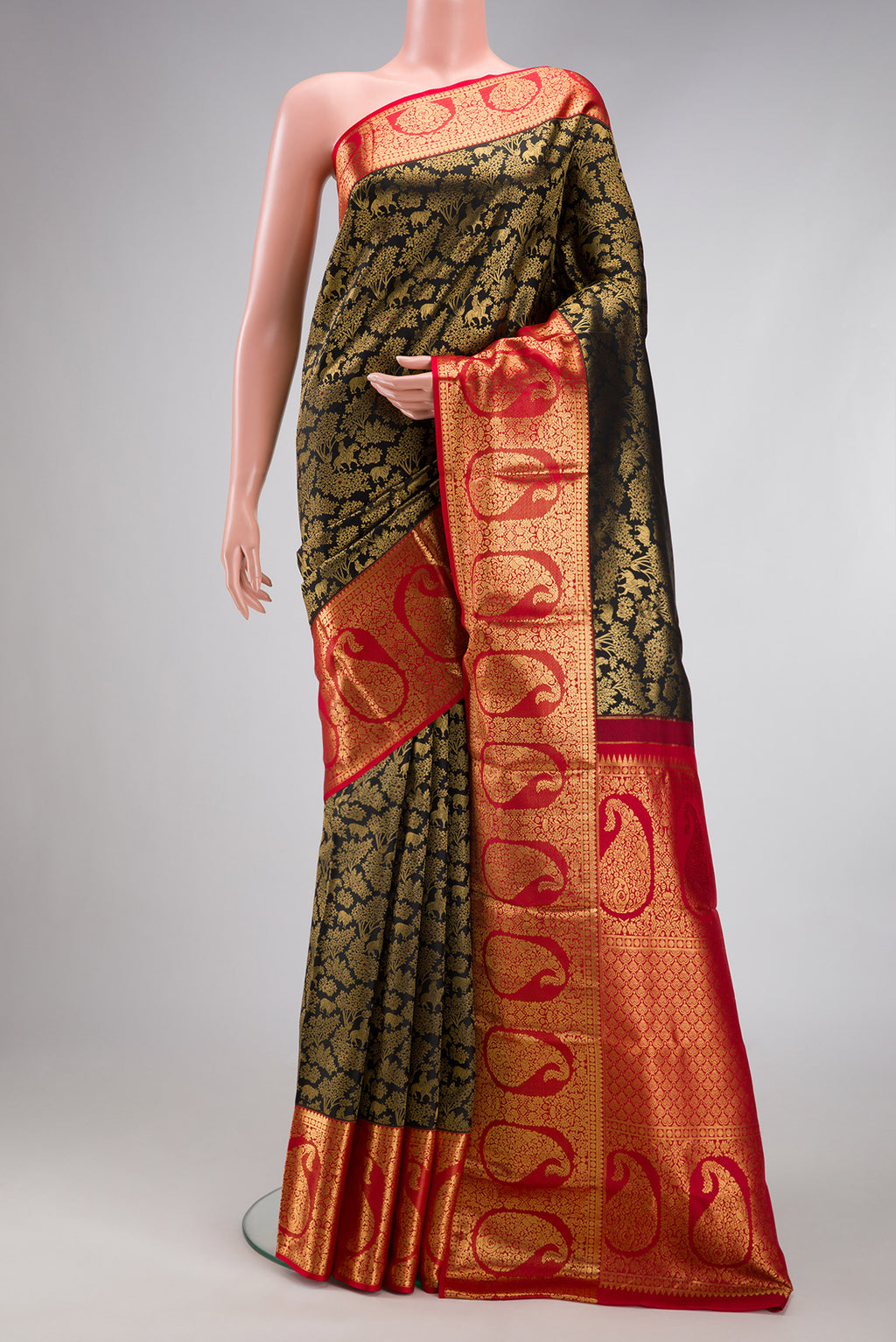 Black Kanchipuram Silk Saree with Zari Brocade on the body and Zari Border.  displayed on a mannequin