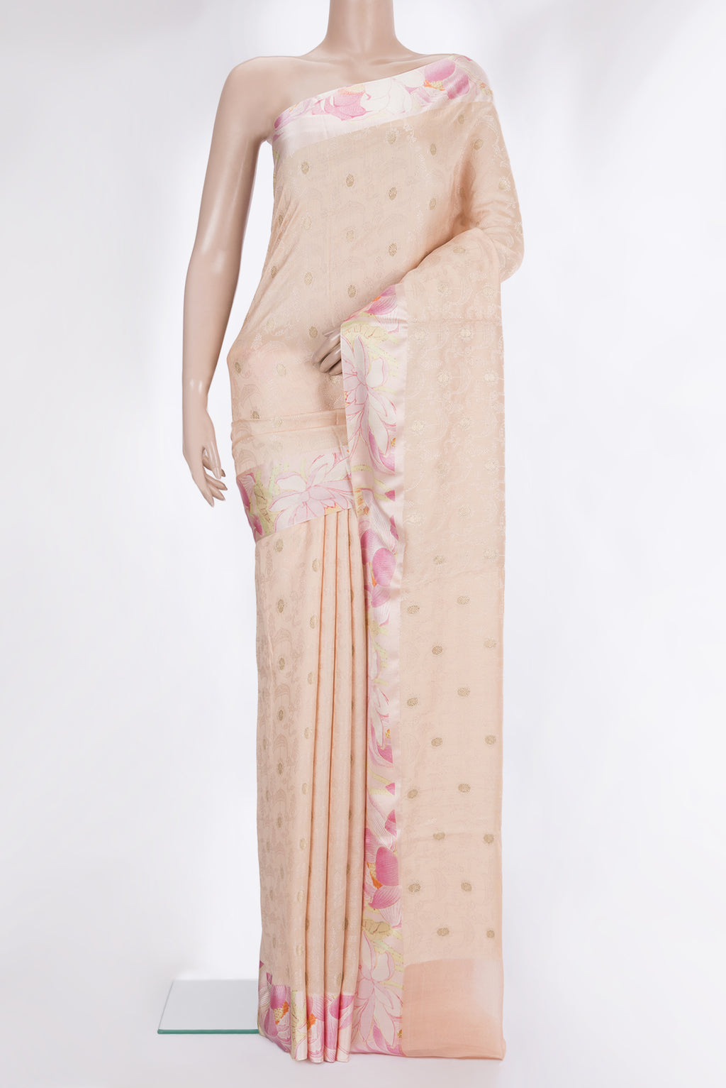 Peach Tussar Saree with Jacquard With Zari Butta on the body and Fancy Border.  displayed on a mannequin
