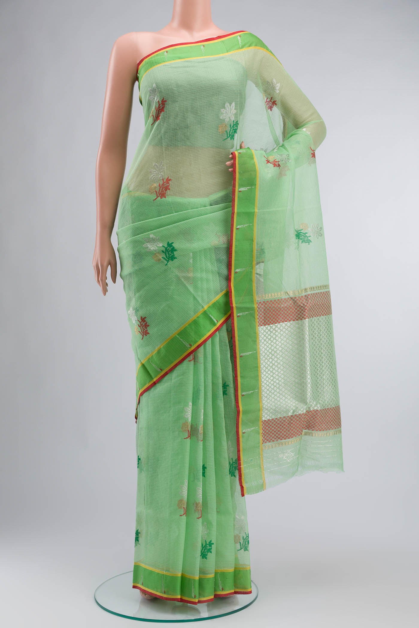 Green Kota Silk Saree with Zari And Thread Butta on the body and Zari Border displayed on a mannequin