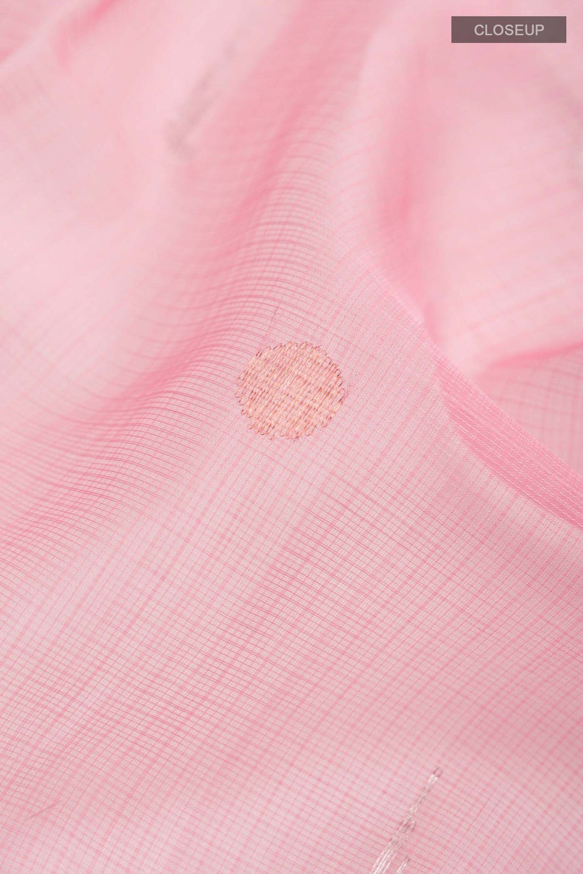 Close up of Pink Kota Silk Saree with Zari Butta on the body and Zari Border displaying folds
