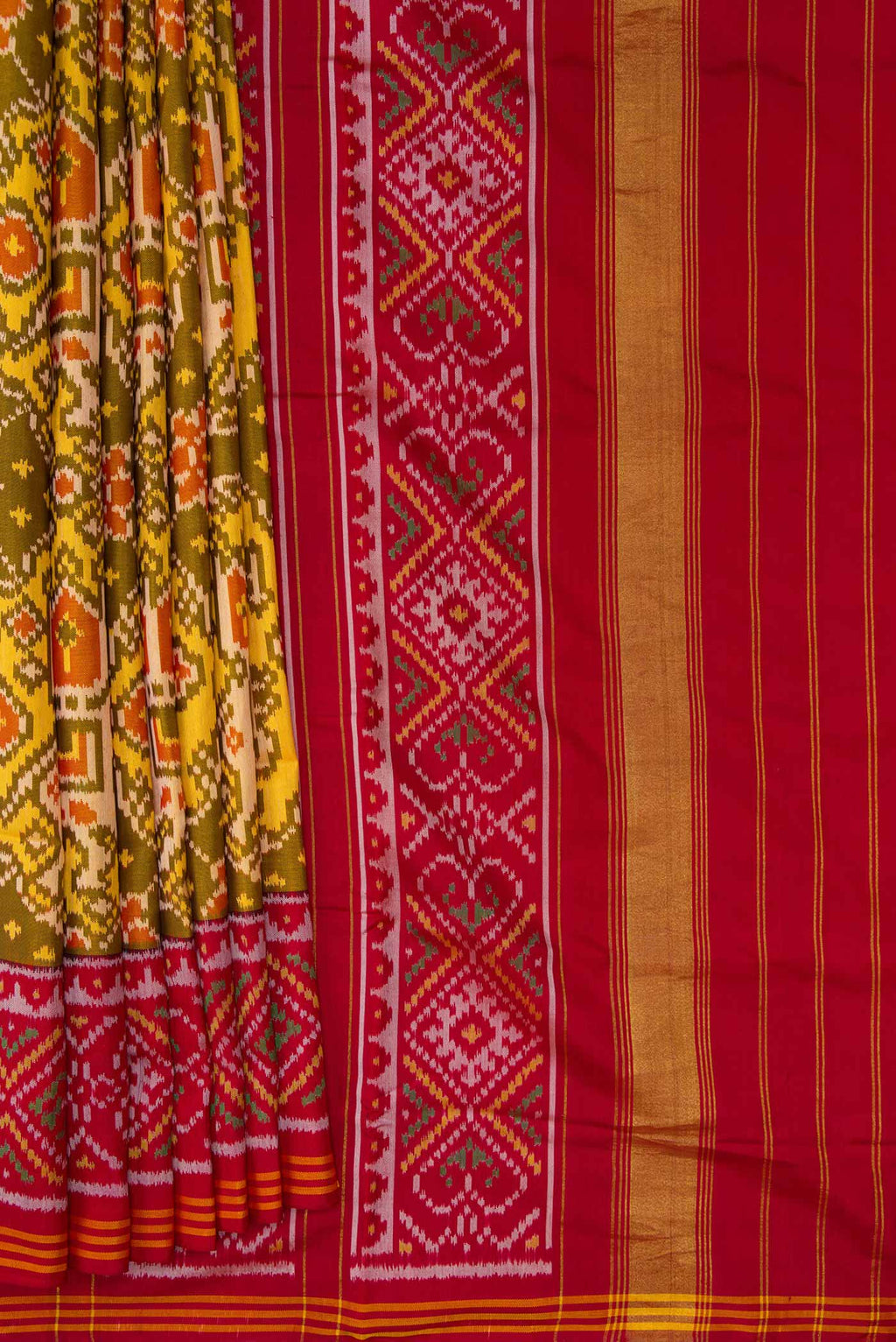 Pleats and pallu of Mehandi Green Dual Tone Rajkot Patola Silk Saree with Ikat Print on the body and Ikat Border