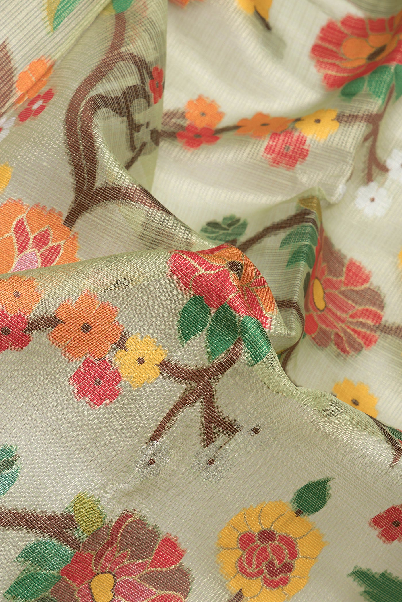 Close up of Green Dual Tone Kota Silk Saree with Zari Brocade on the body and Paithani Border.  displaying folds