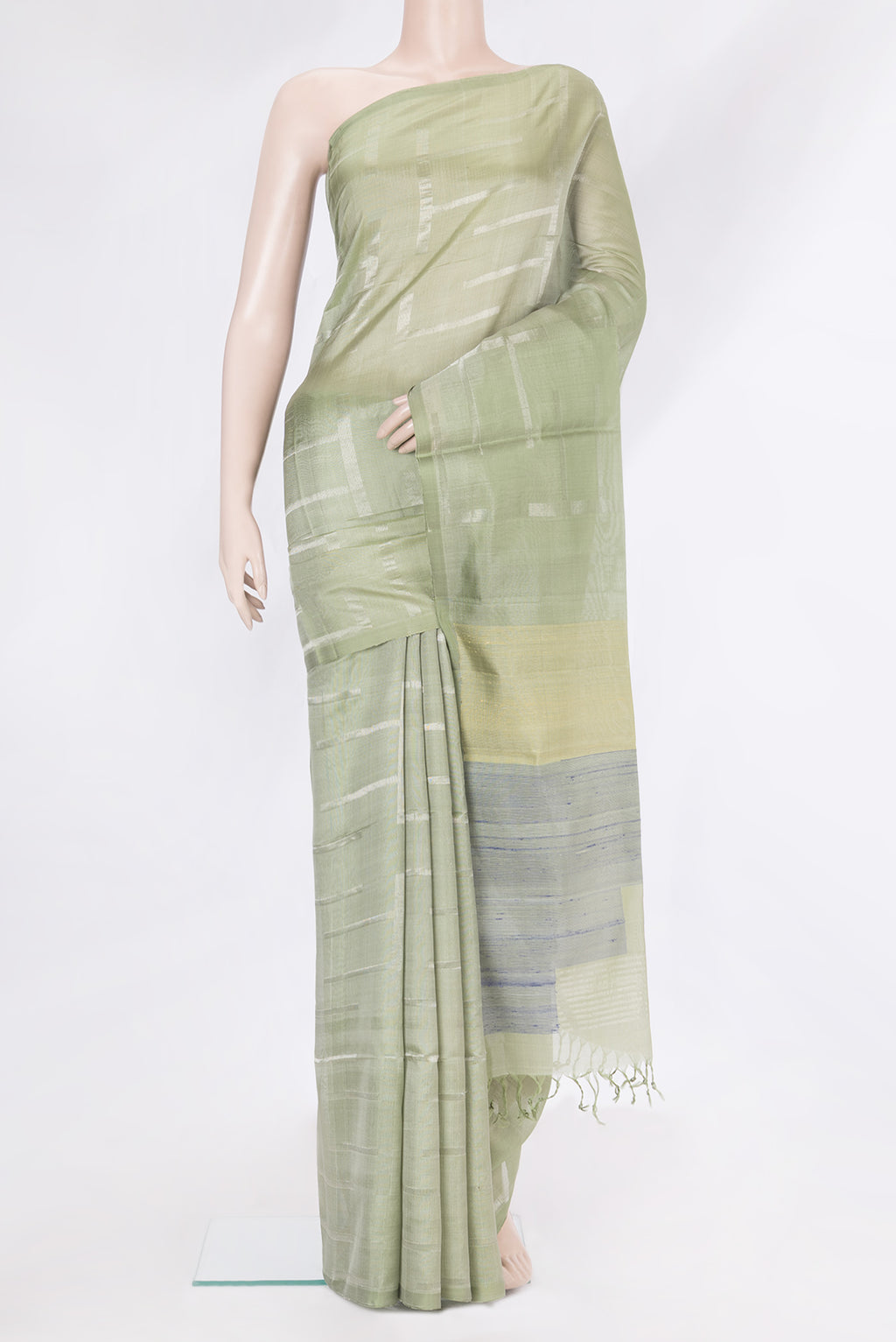Pista Green Tussar Silk Saree with Checked design on the body and Zari Border.  displayed on a mannequin
