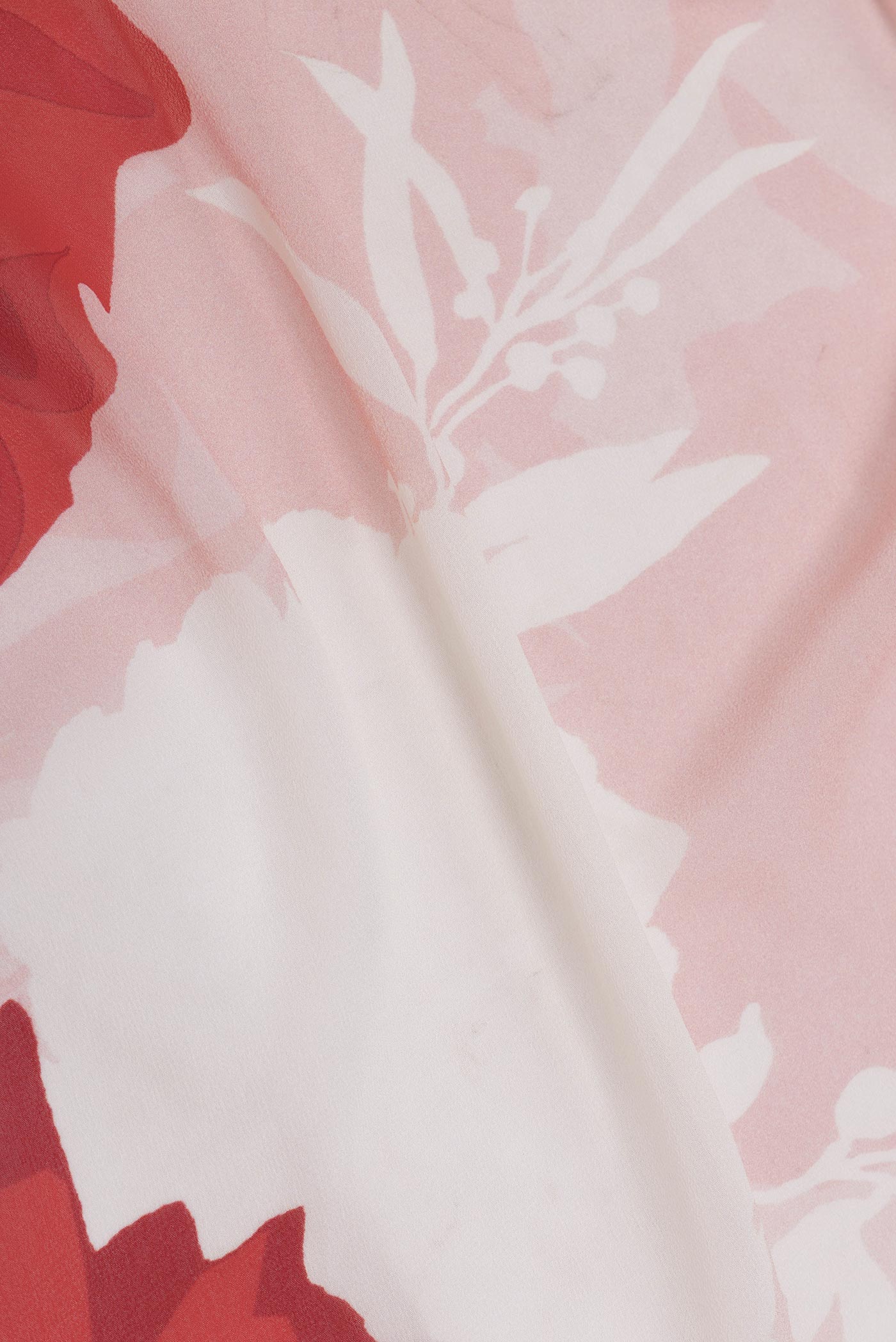 Close up of Pink Dual Tone Georgette Saree with Printed design on the body and Without Border displaying folds
