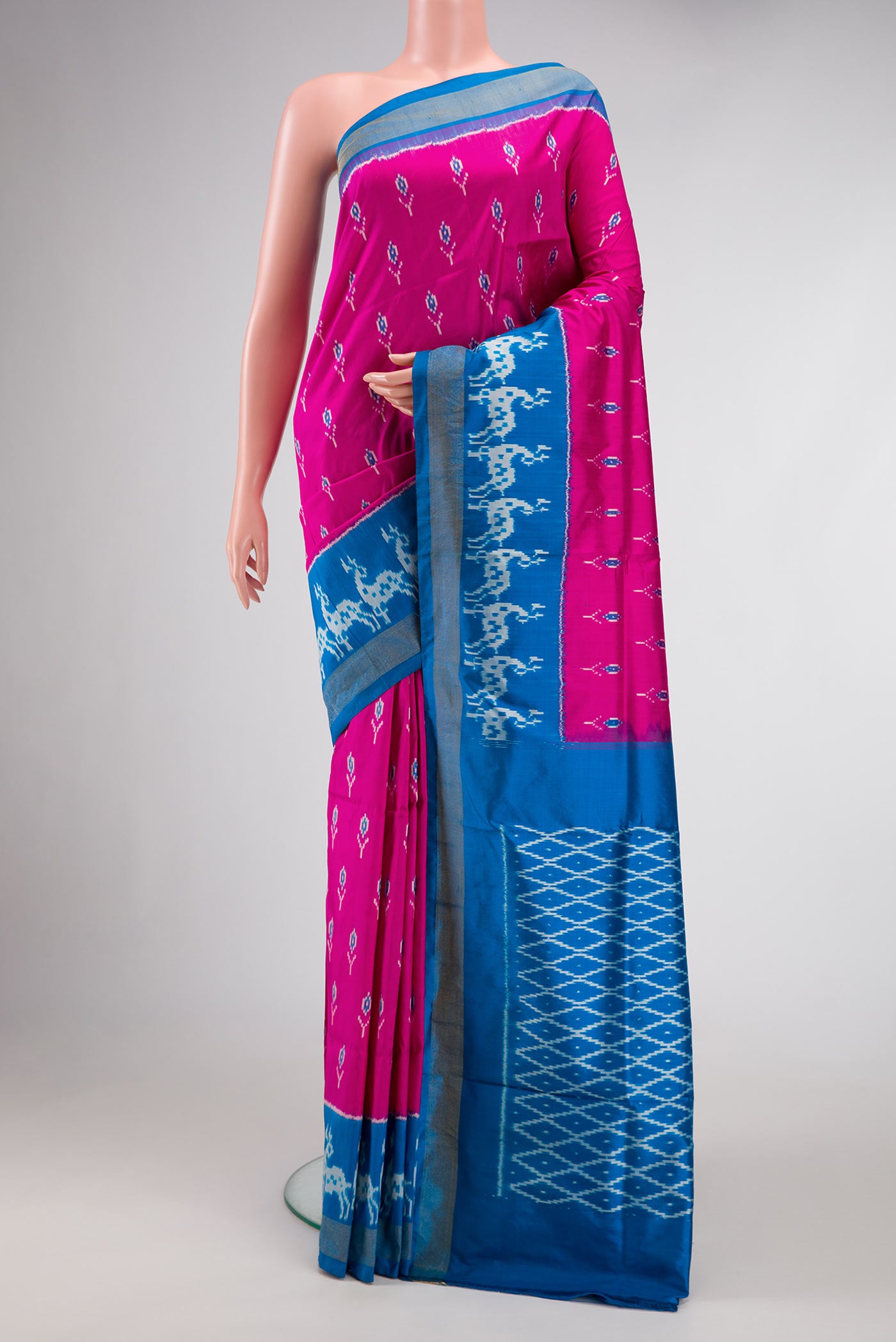 Pink Dual Tone Double Ikat Saree with Ikat Print on the body and Ikat Border.  displayed on a mannequin