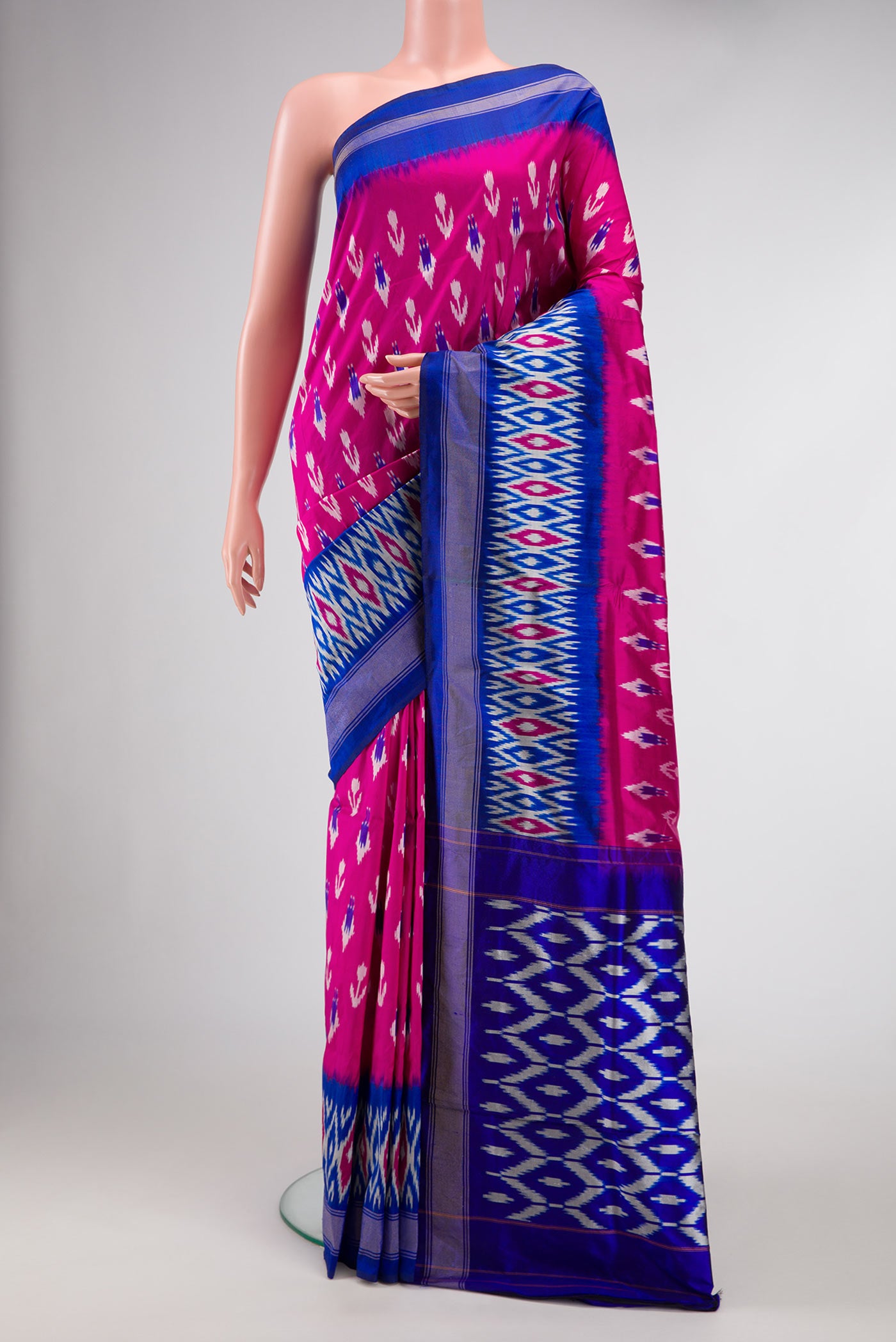 Pink Dual Tone Double Ikat Saree with Ikat Print on the body and Ikat Border.  displayed on a mannequin