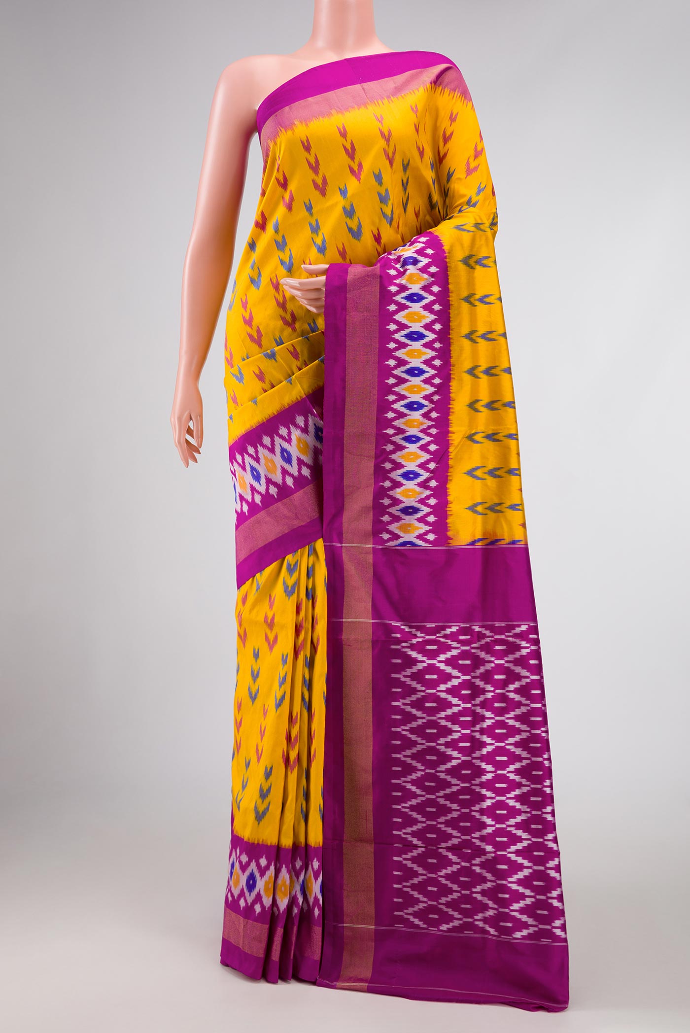 Yellow Pochampally Silk Saree with Pure Ikat on the body and Zari Border displayed on a mannequin