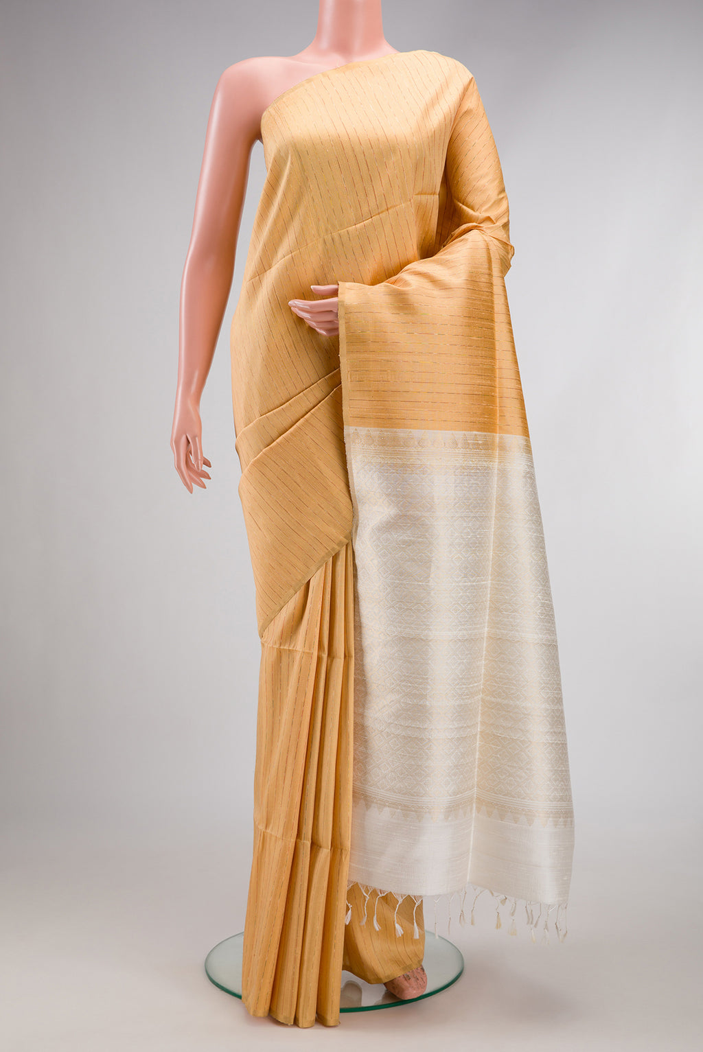 Sandal Raw Silk Saree with Stripes on the body and Thin Zari Line.  displayed on a mannequin