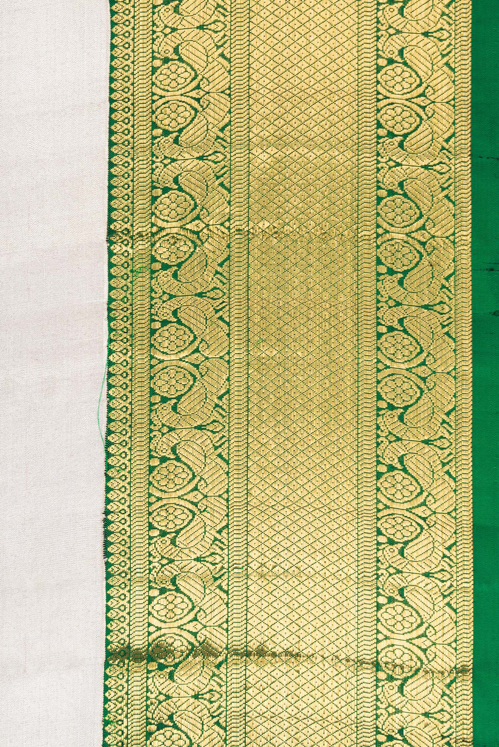 Border image of Off White Dual Tone Kanchipuram Tissue Silk Saree with Plain Body and Zari Border. 