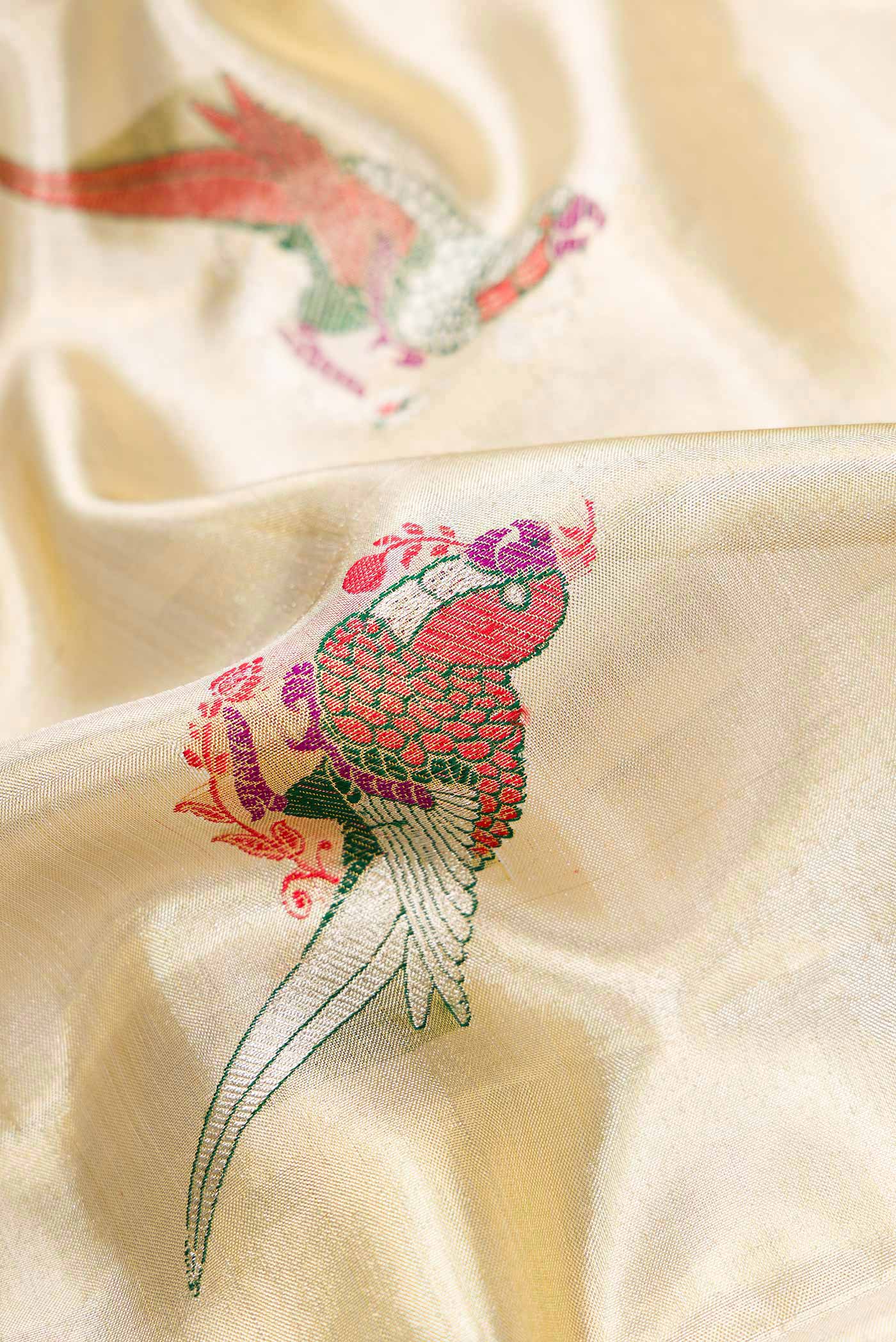 Close up of Gold Dual Tone Kanjivaram Tissue Silk Saree with Zari Brocade on the body and Zari Border.  displaying folds