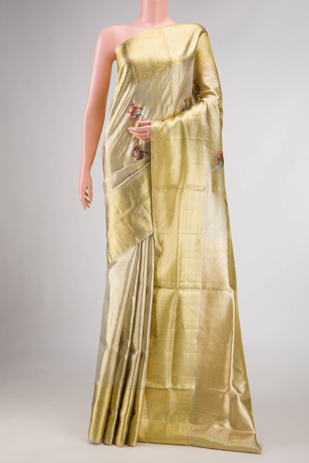 Gold Dual Tone Kanjivaram Tissue Silk Saree with Zari Brocade on the body and Zari Border.  displayed on a mannequin