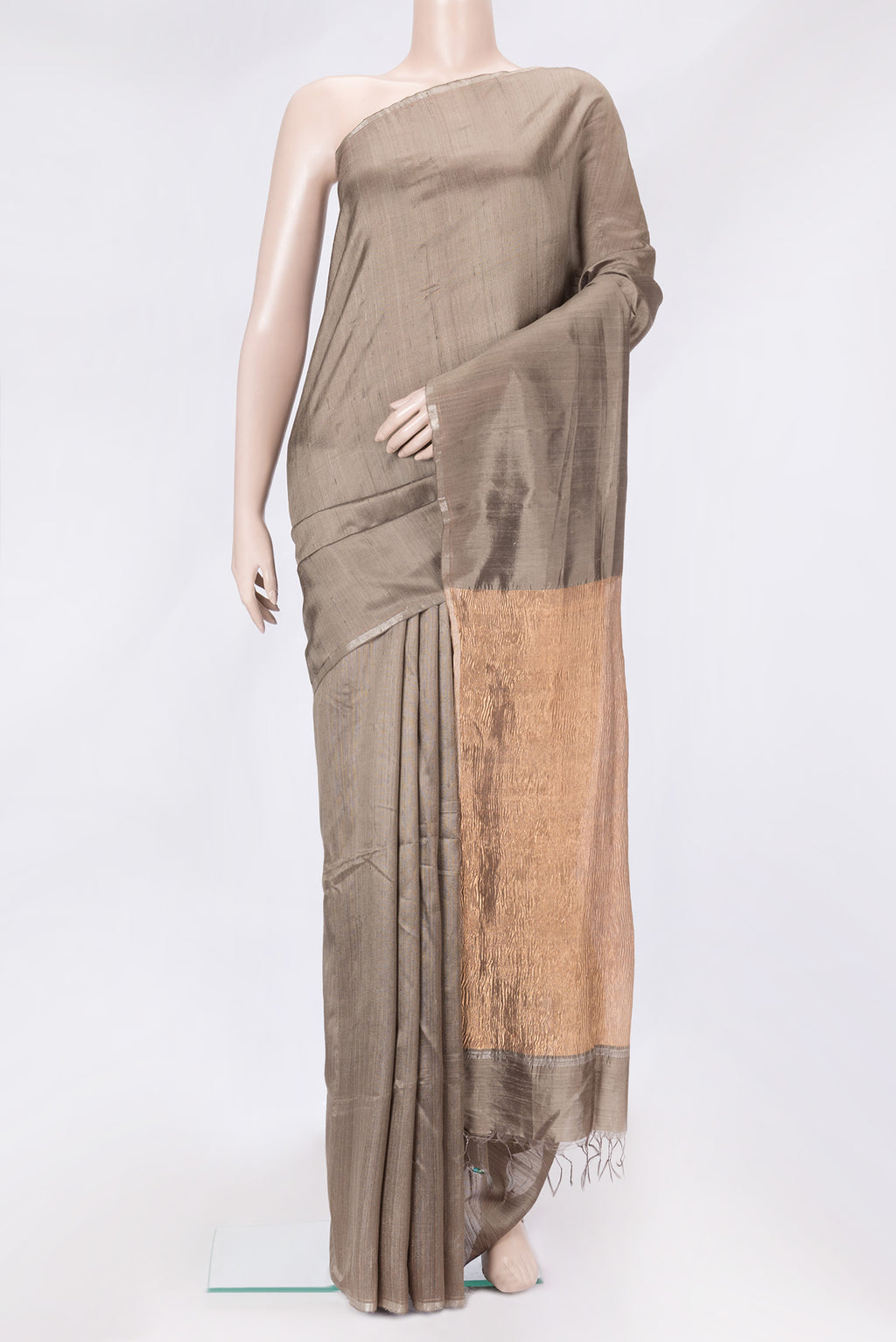Grey Dual Tone Raw Silk Saree with Plain Body and Thin Zari Line.  displayed on a mannequin