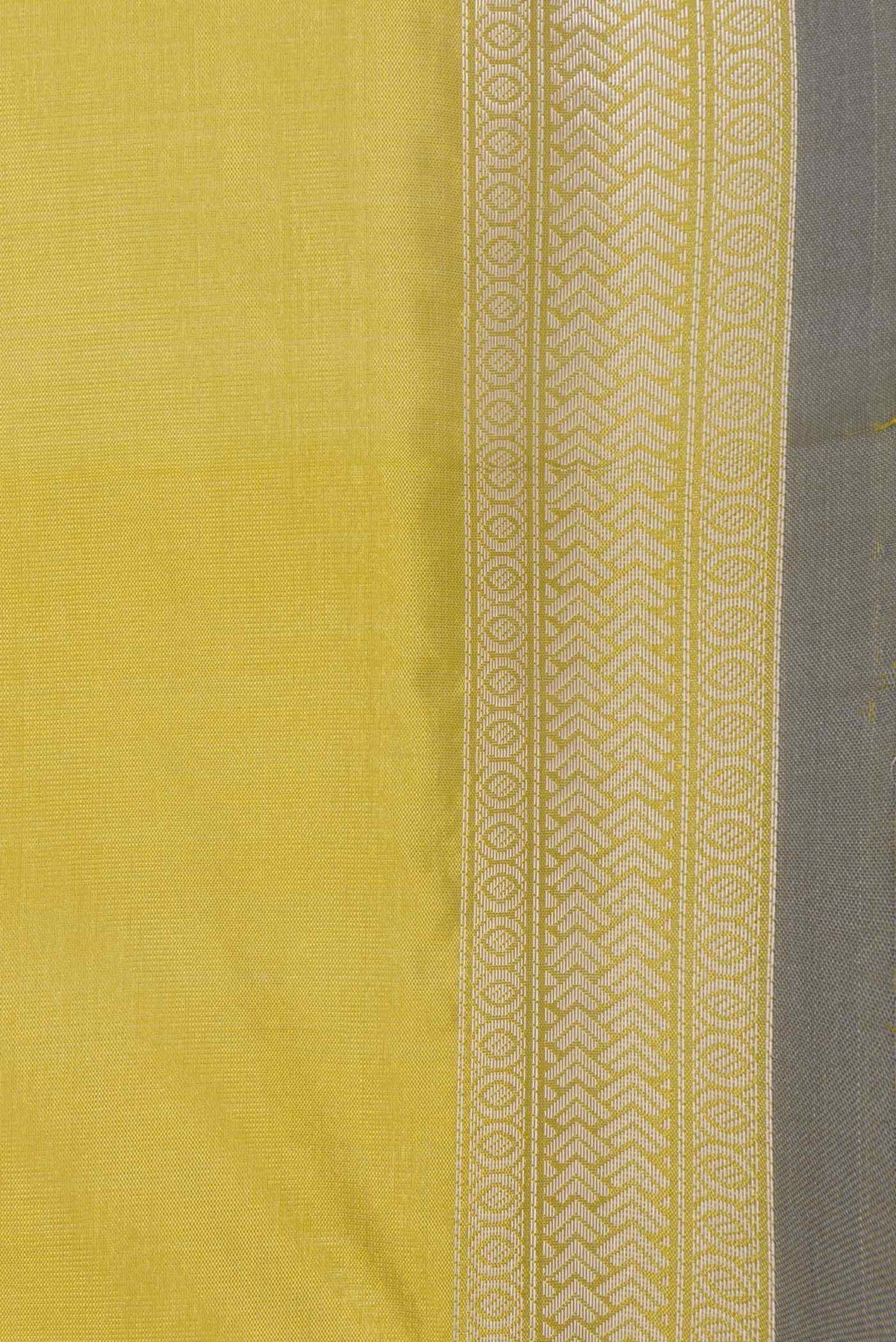 Border image of Green Dual Tone Tussar Saree with Zari Butta on the body and Zari Border