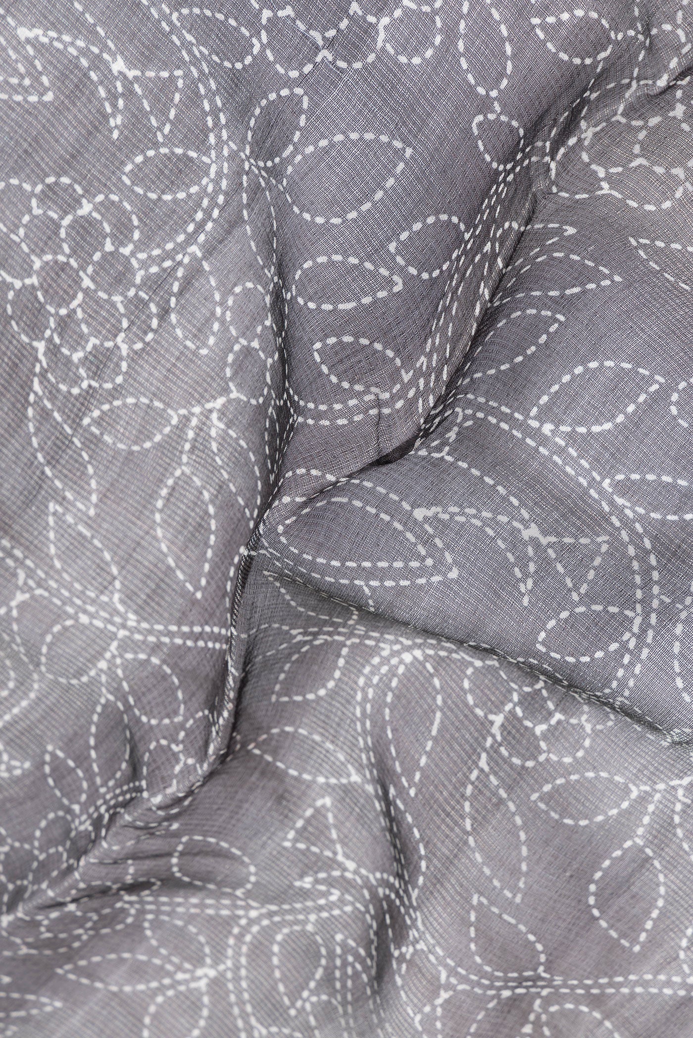 Close up of Black Dual Tone Tussar Silk Saree with Printed design on the body and Plain Border.  displaying folds