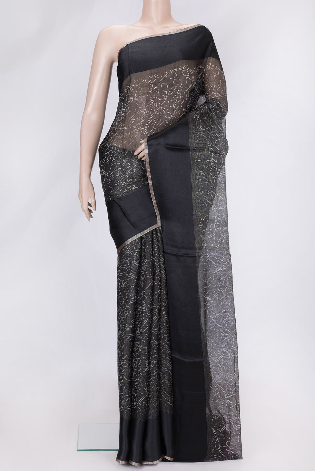 Black Dual Tone Tussar Silk Saree with Printed design on the body and Plain Border.  displayed on a mannequin