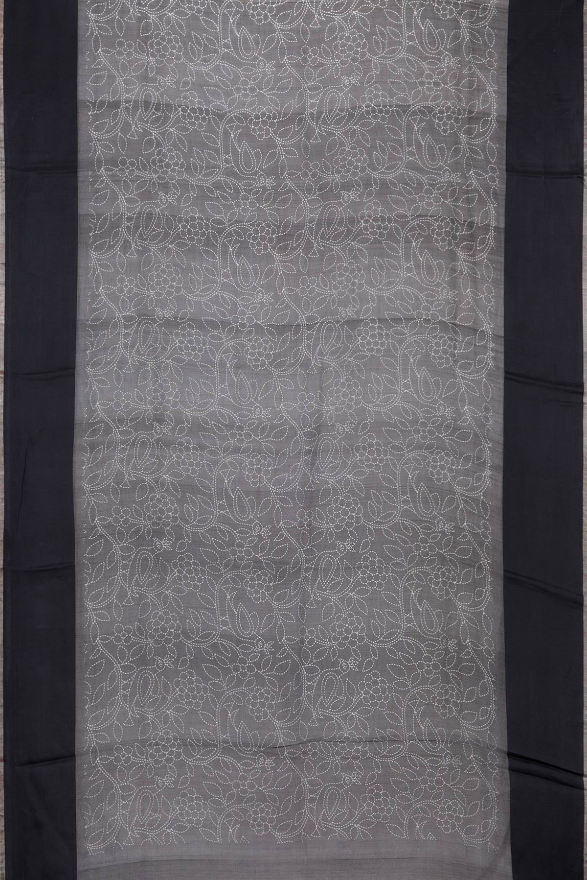 Flat view of Black Dual Tone Tussar Silk Saree with Printed design on the body and Plain Border. 