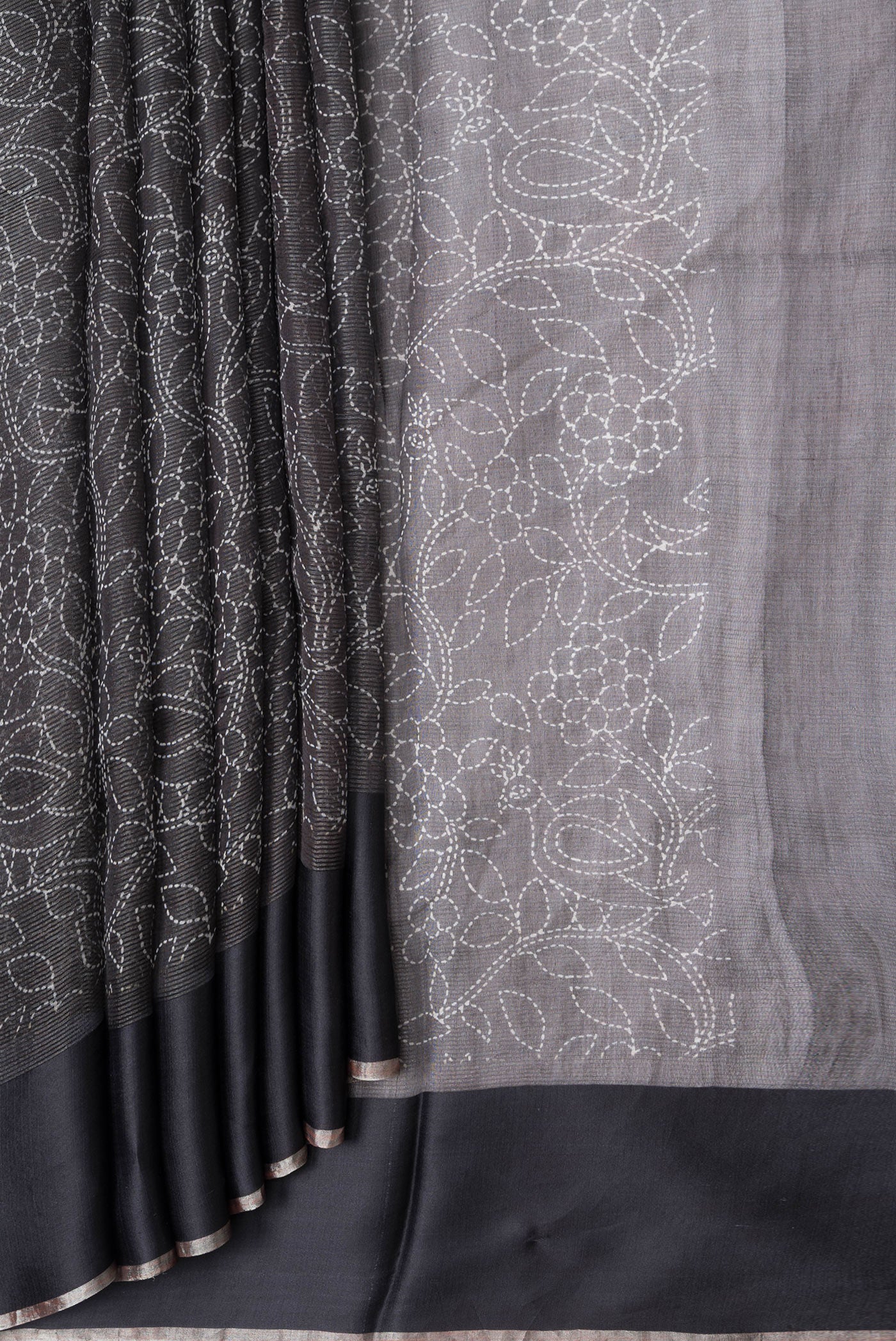 Pleats and pallu of Black Dual Tone Tussar Silk Saree with Printed design on the body and Plain Border. 