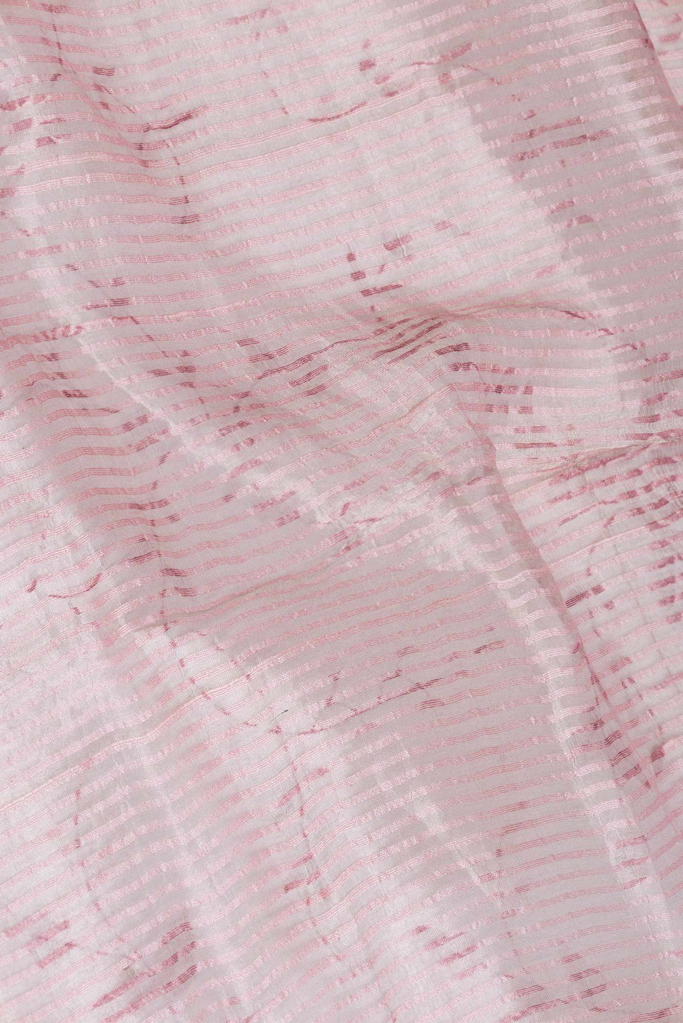 Close up of Pink Dual Tone Tussar Saree with Stripes on the body and Printed Border displaying folds