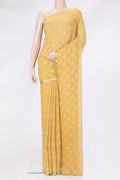 Yellow Mysore Chiffon Saree with Printed design on the body and Zari Border.  displayed on a mannequin