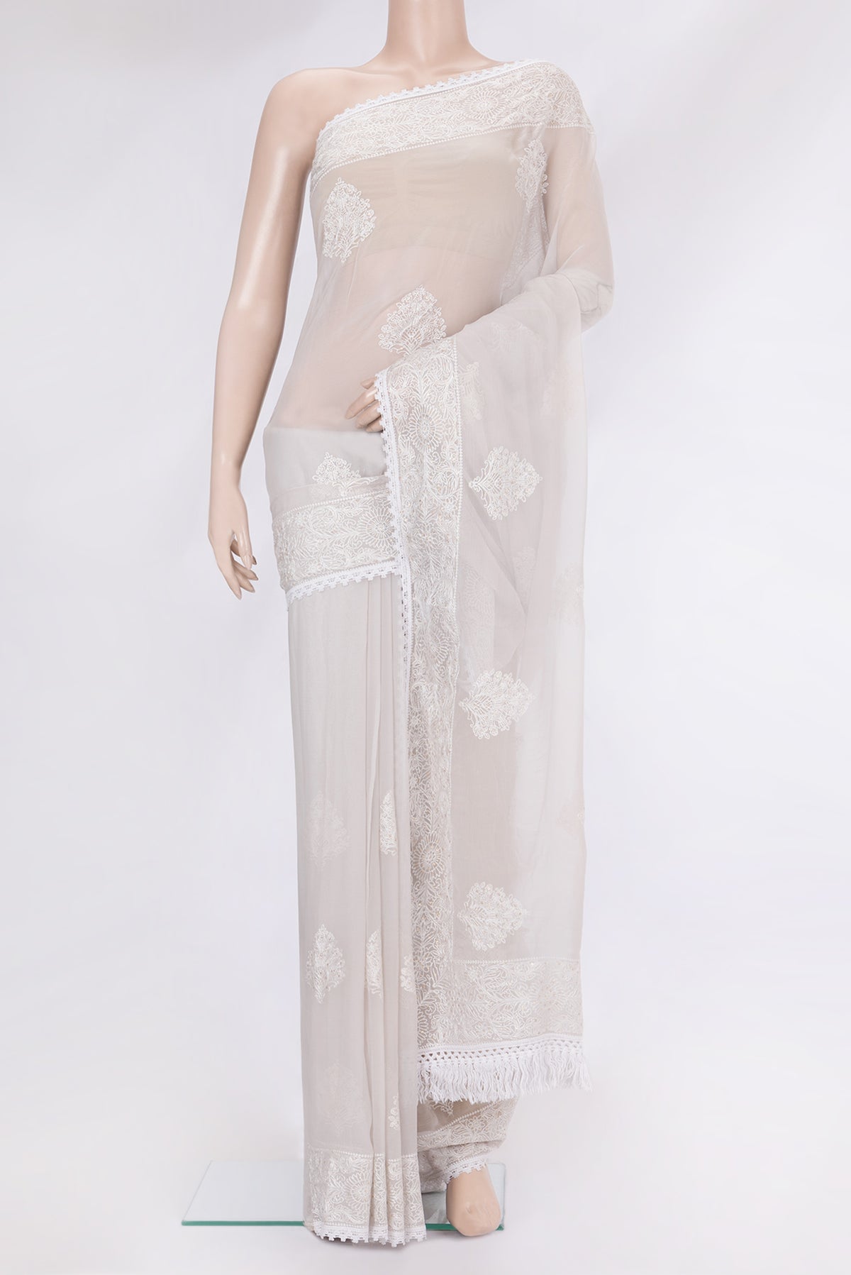 Grey Blended Chiffon Saree with Embroidery on the body and Embroidery Border.  displayed on a mannequin