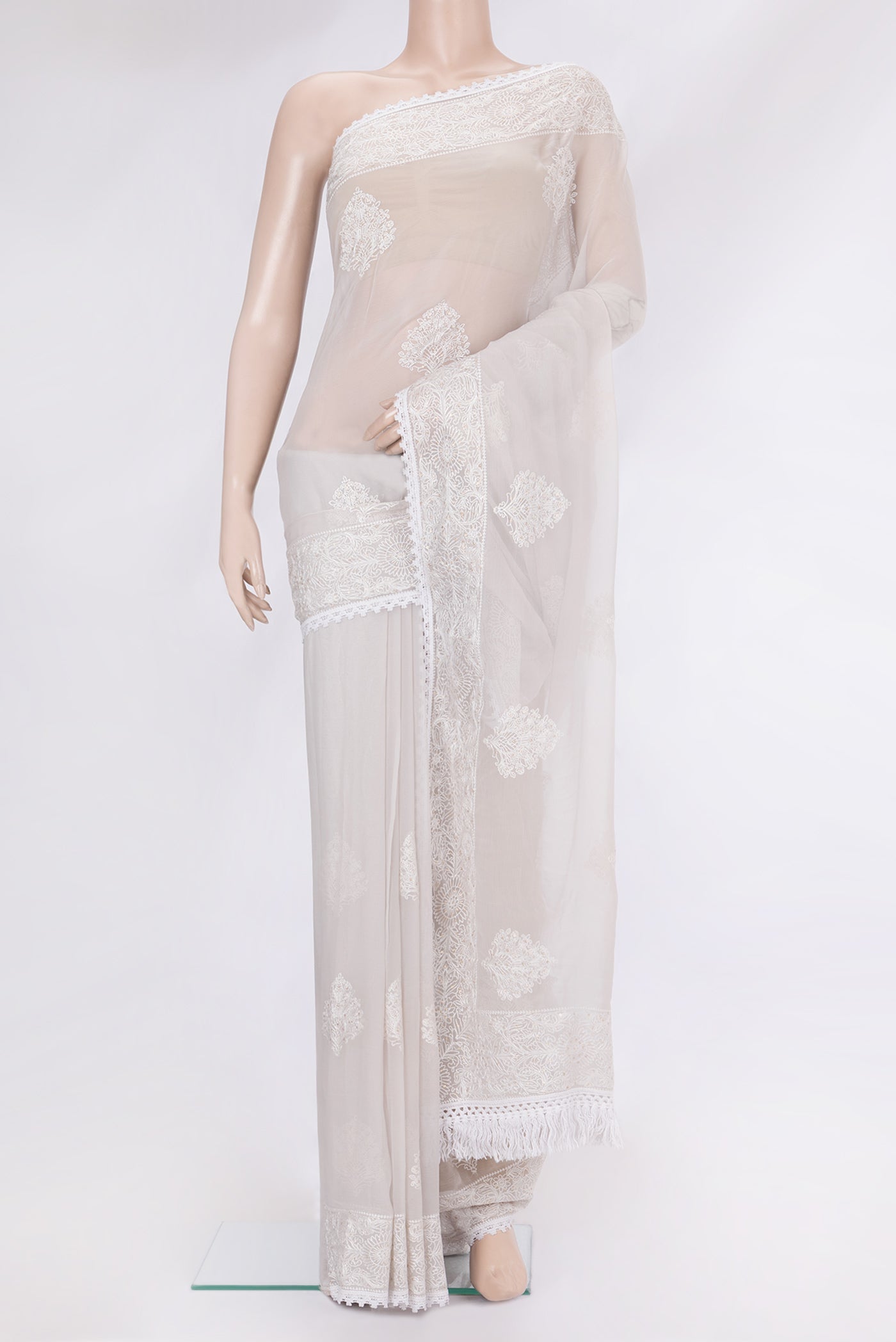 Grey Blended Chiffon Saree with Embroidery on the body and Embroidery Border.  displayed on a mannequin