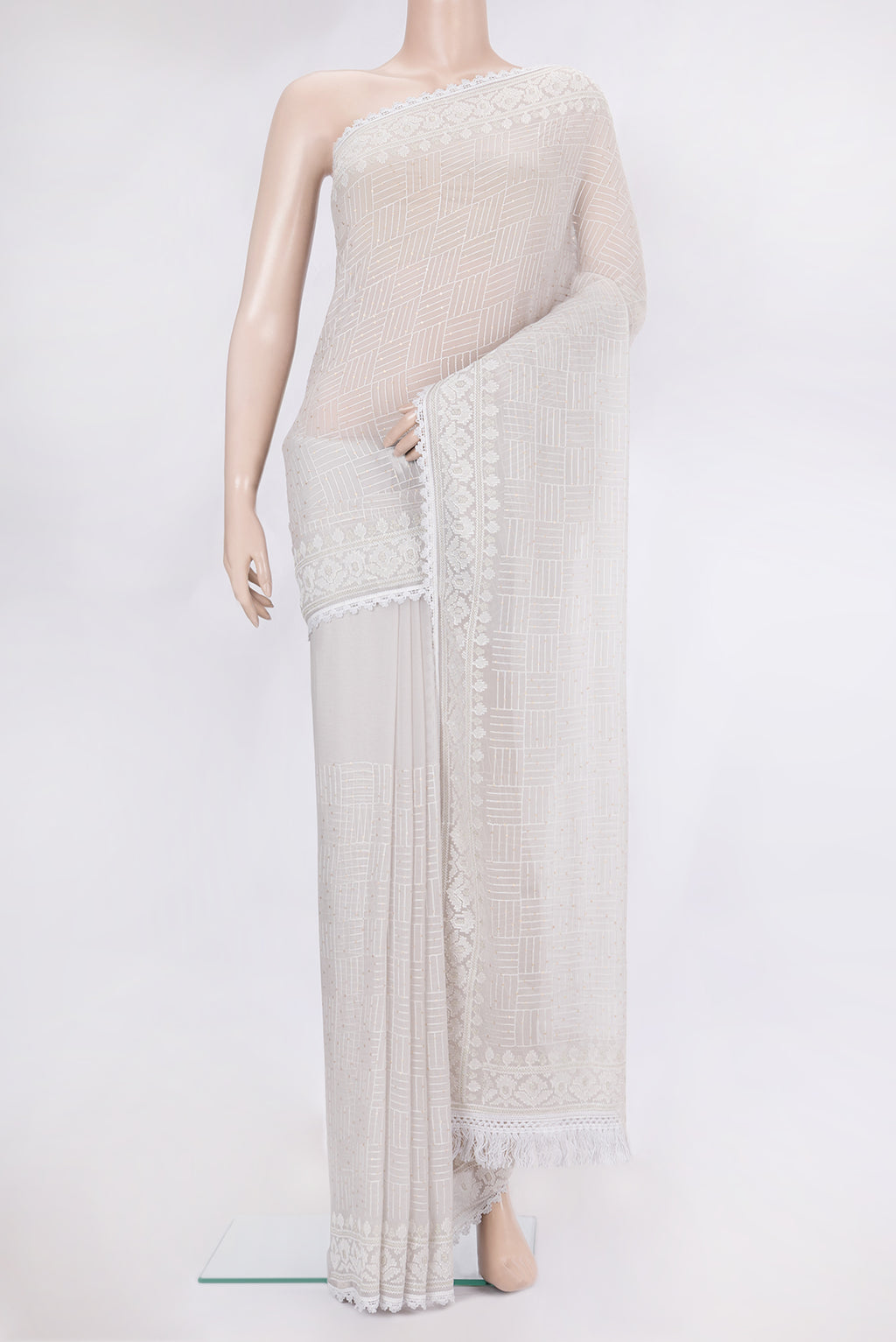 Grey Dual Tone Blended Chiffon Saree with Embroidery on the body and Sequin Border.  displayed on a mannequin