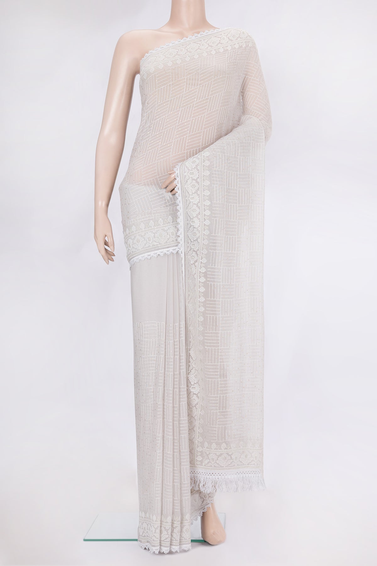 Grey Dual Tone Blended Chiffon Saree with Embroidery on the body and Sequin Border.  displayed on a mannequin