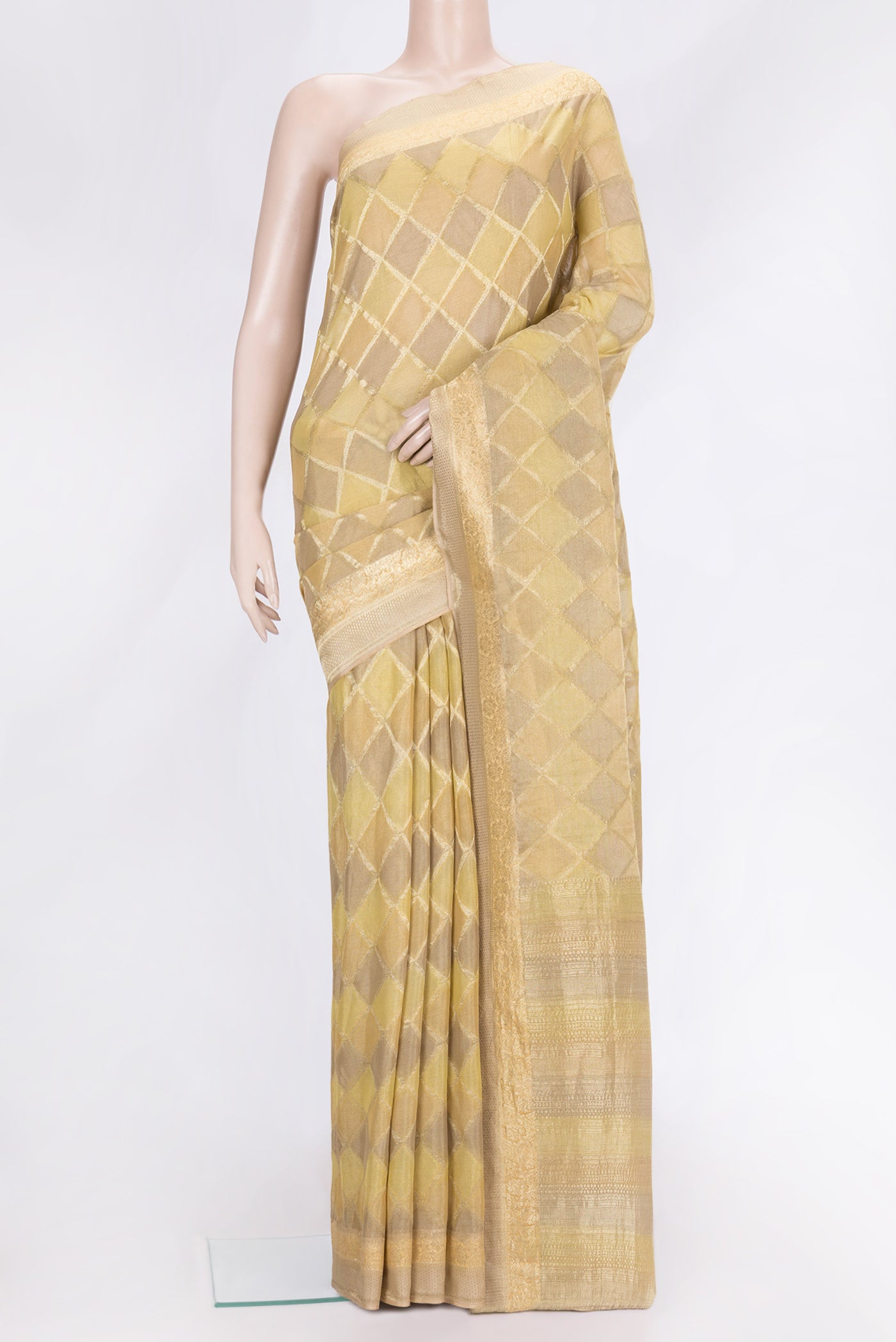 Gold Dual Tone Mysore Georgette Saree with Zari Brocade on the body and Zari Border.  displayed on a mannequin