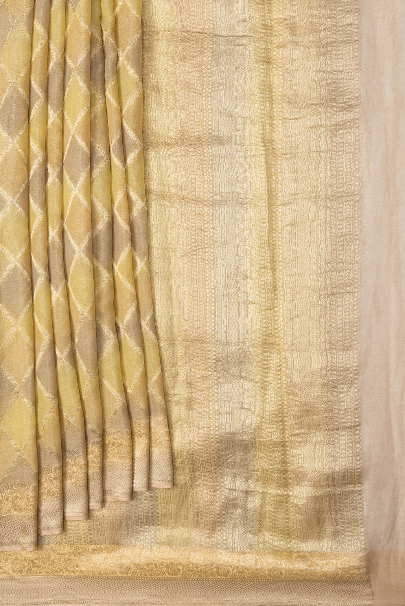 Pleats and pallu of Gold Dual Tone Mysore Georgette Saree with Zari Brocade on the body and Zari Border. 