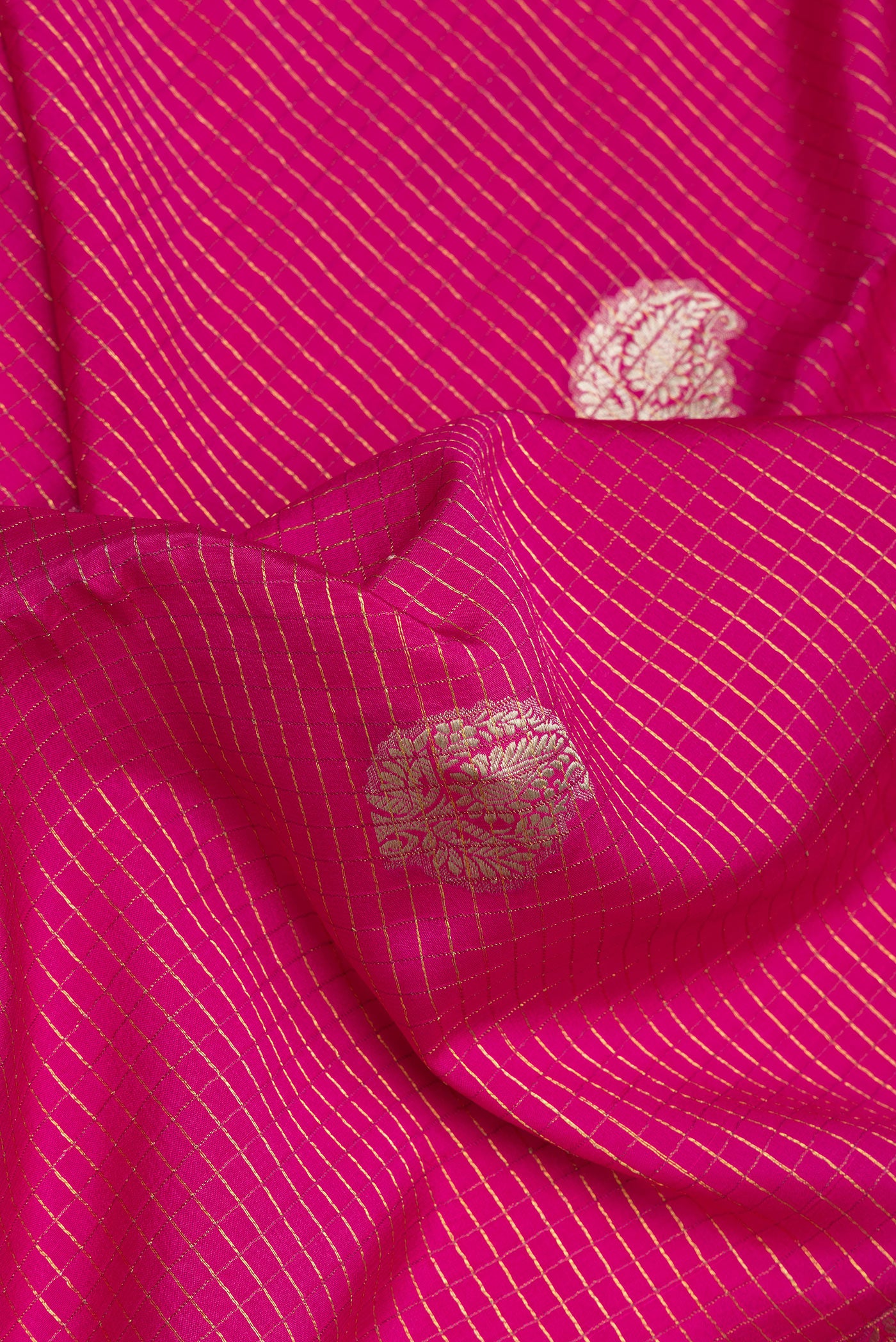 Close up of Pink Mysore Silk Saree with Checked design on the body and Zari Border.  displaying folds