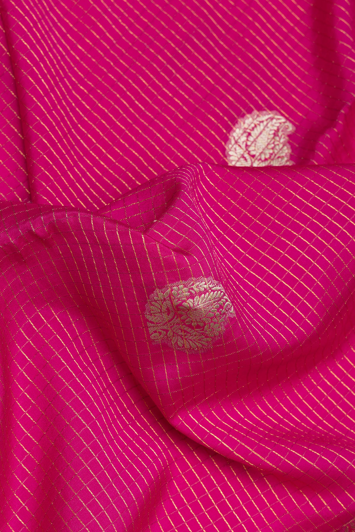 Close up of Pink Mysore Silk Saree with Checked design on the body and Zari Border.  displaying folds
