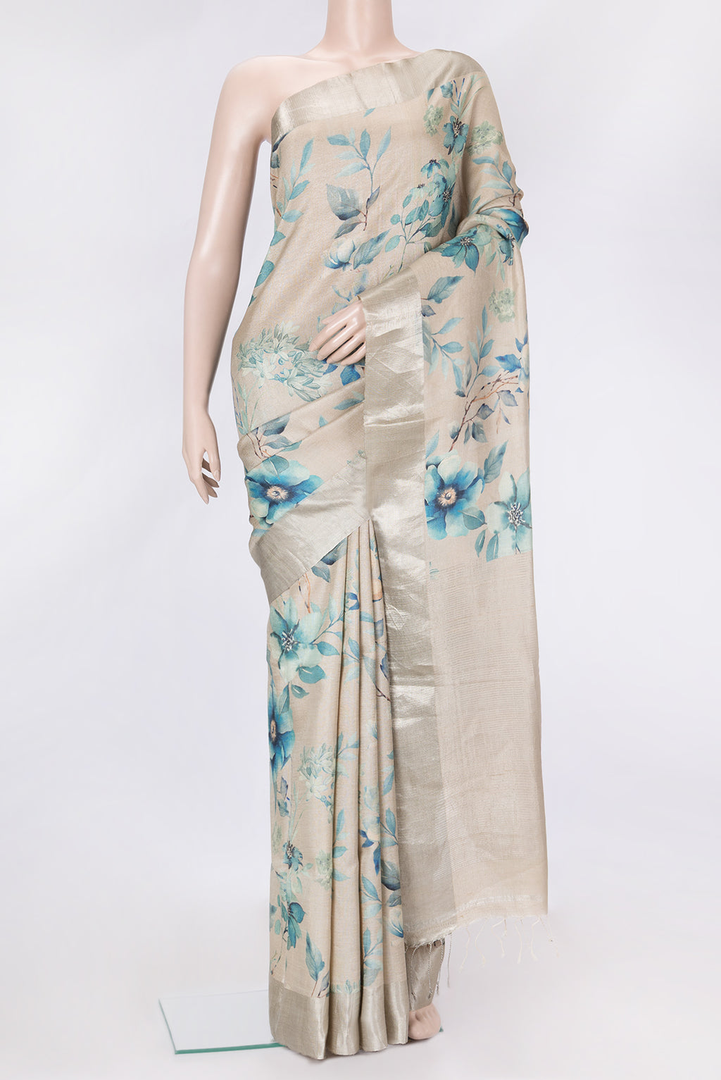 Beige Dual Tone Tussar Silk Saree with Printed design on the body and Zari Border.  displayed on a mannequin