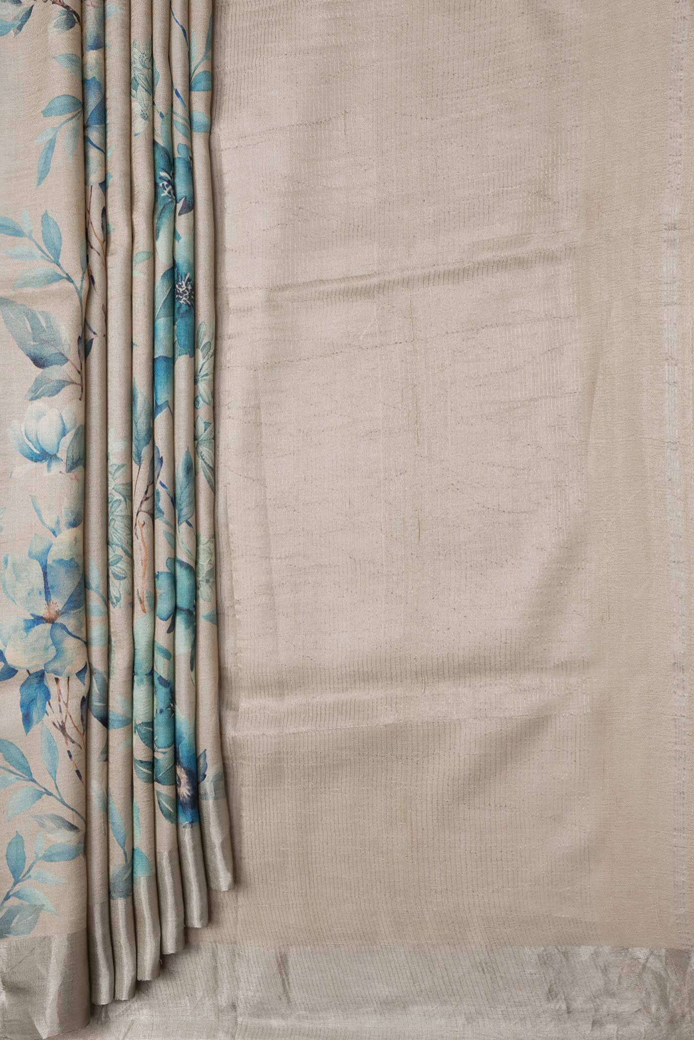 Pleats and pallu of Beige Dual Tone Tussar Silk Saree with Printed design on the body and Zari Border. 