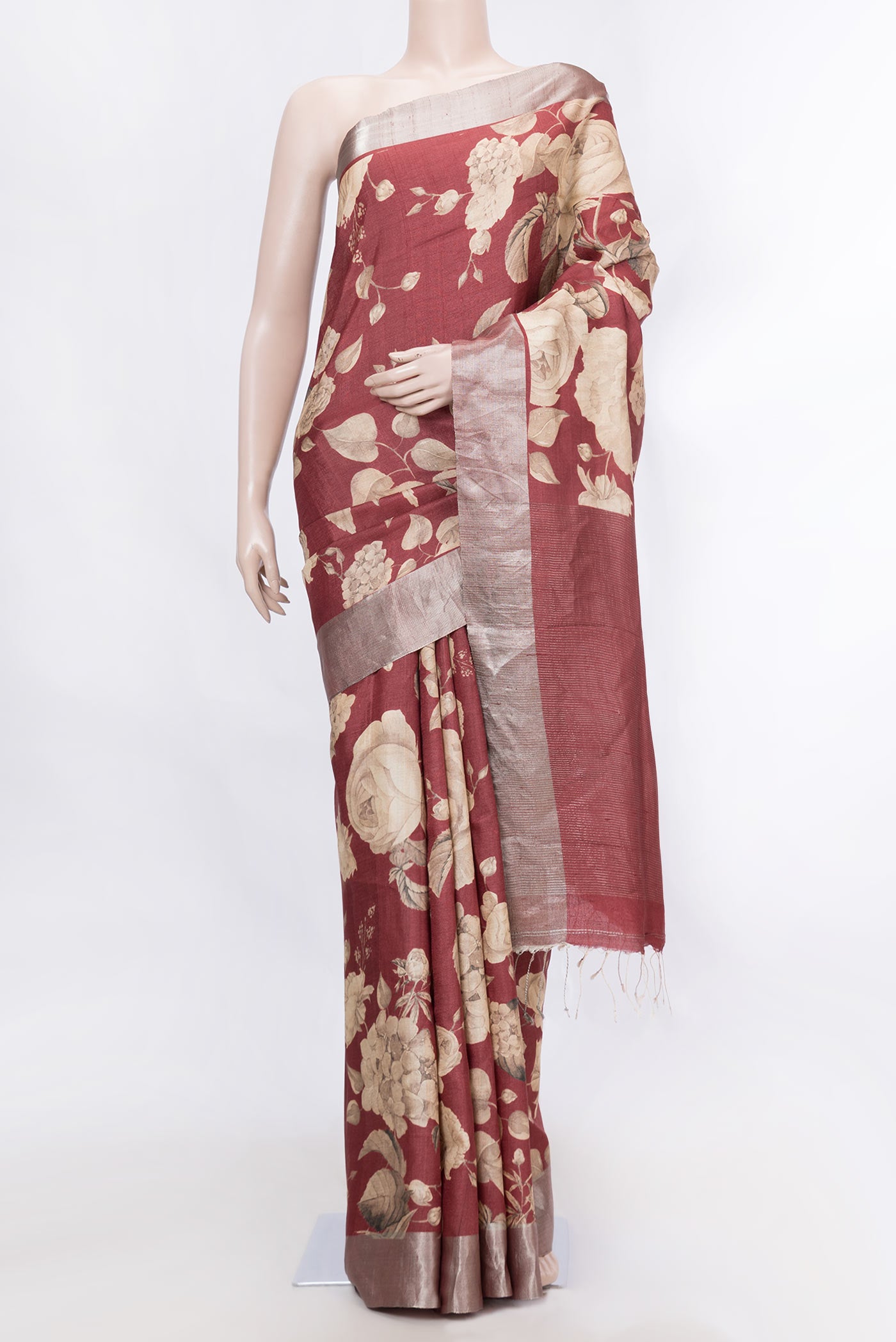 Maroon Dual Tone Tussar Silk SareePrinted design on the body and Zari Border displayed on a mannequin
