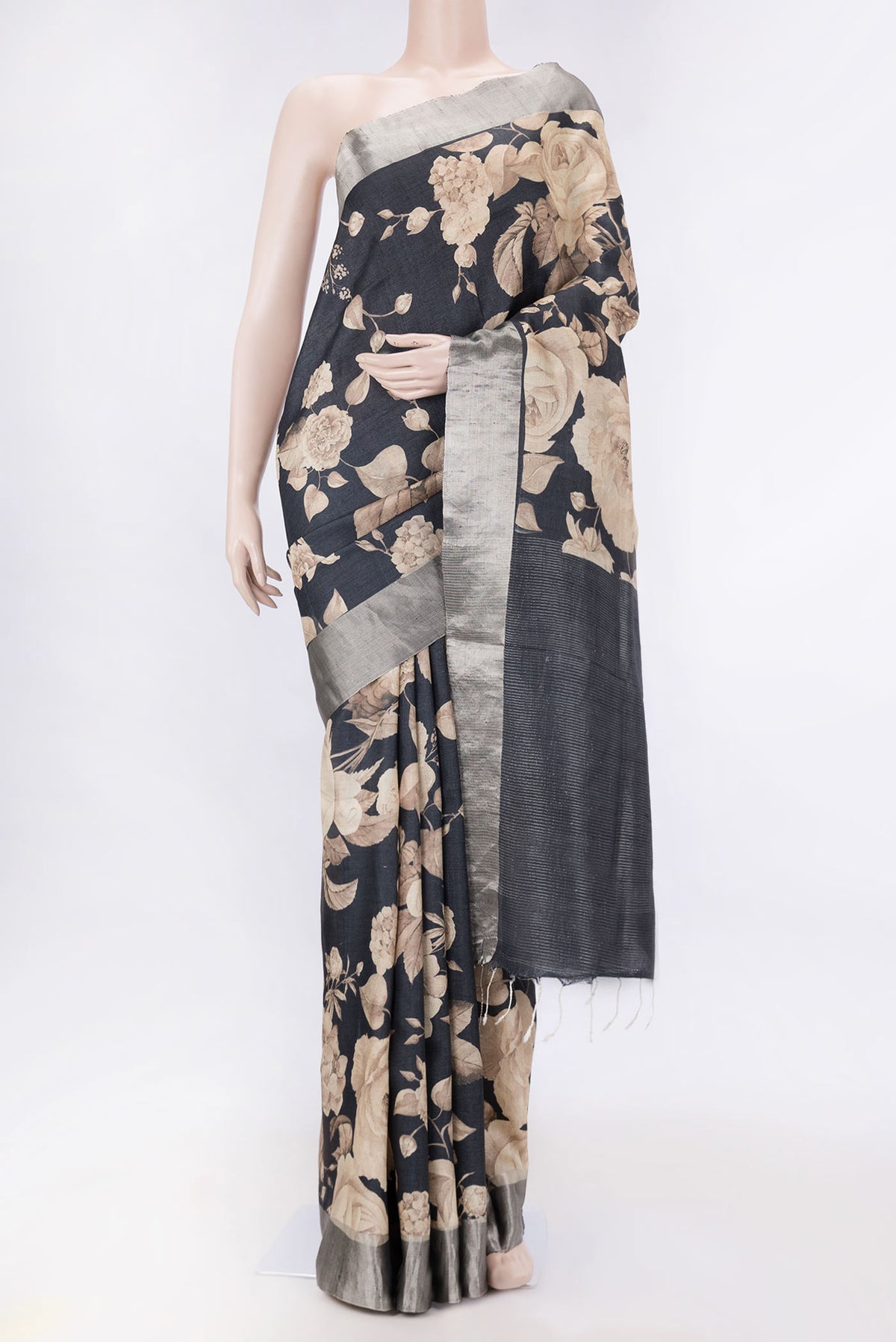 Black Dual Tone Tussar Silk SareePrinted design on the body and Zari Border displayed on a mannequin