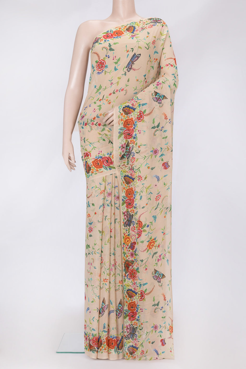 Beige Dual Tone Mysore Georgette Saree with Printed design on the body and Without Border.  displayed on a mannequin
