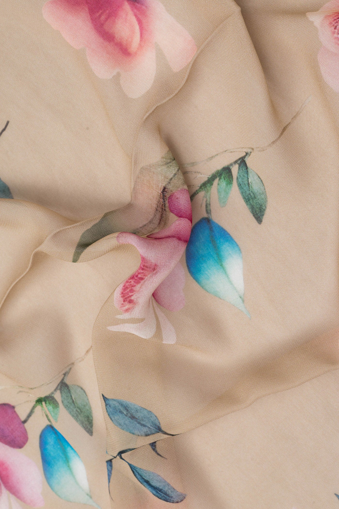 Close up of Beige Dual Tone Mysore Georgette Saree with Printed design on the body and Without Border.  displaying folds