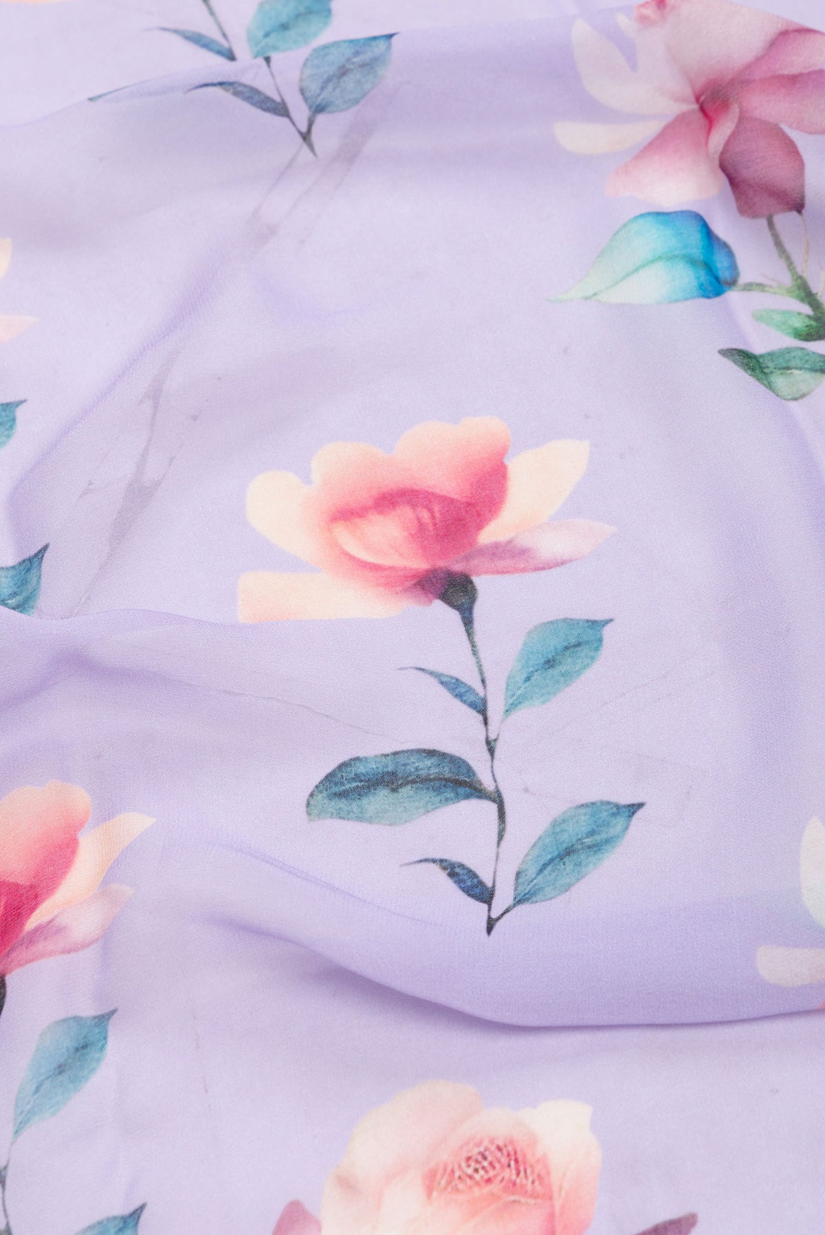 Close up of Lavender Dual Tone Mysore Georgette SareePrinted design on the body and Zari Border displaying folds