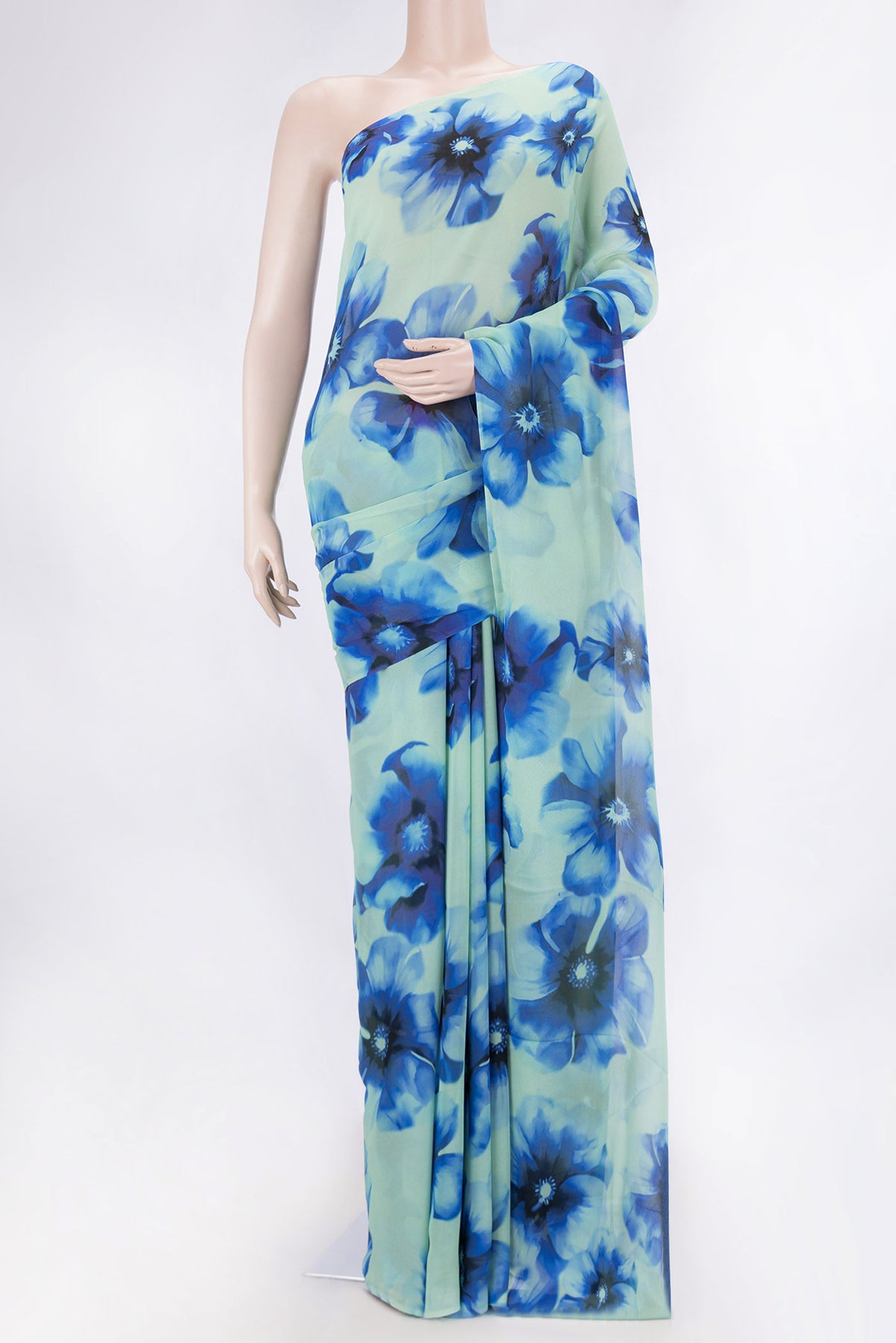 Green Dual Tone Mysore Georgette SareePrinted design on the body and Zari Border displayed on a mannequin