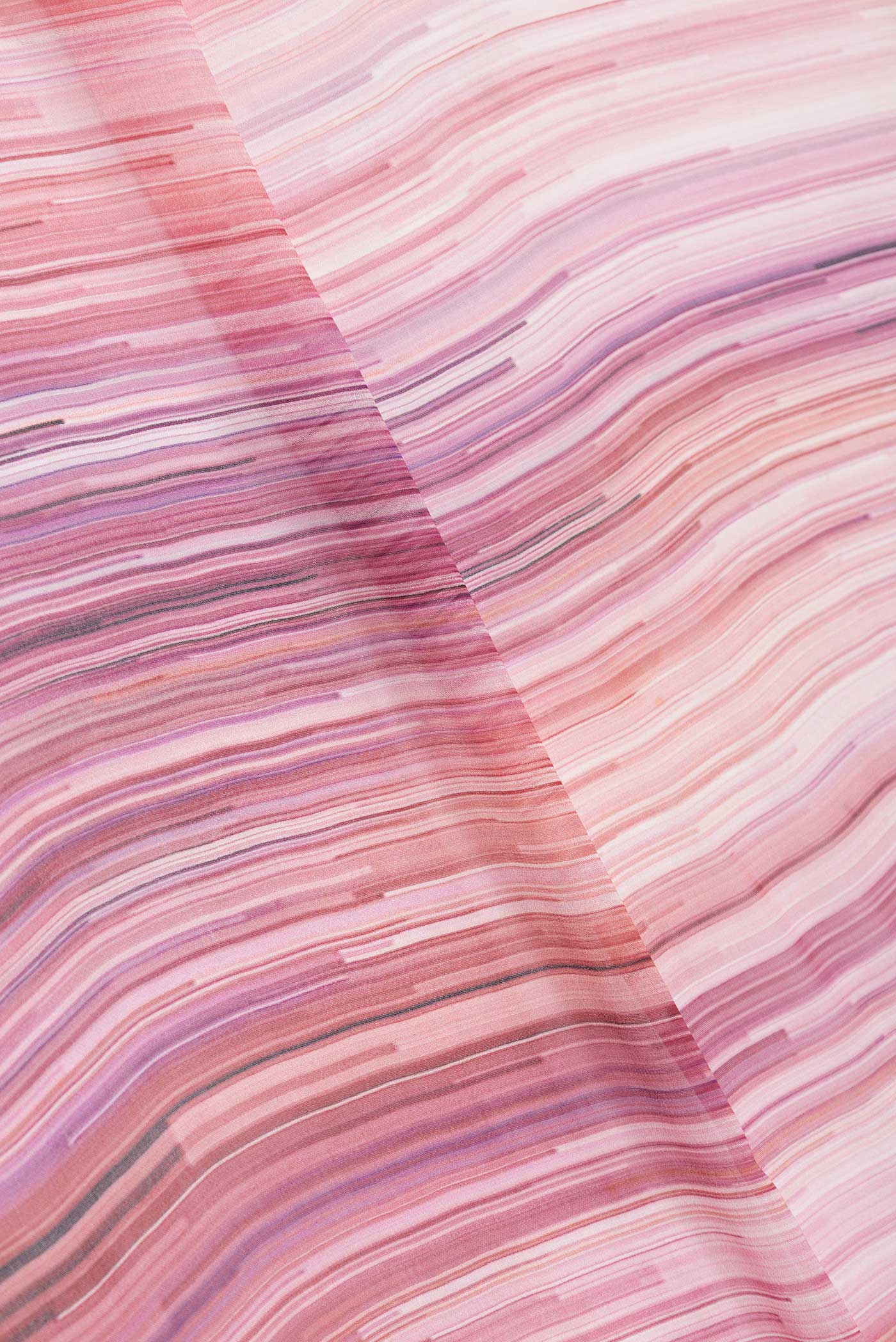 Close up of Pink Dual Tone Mysore Georgette Saree with Stripes on the body and Without Border displaying folds